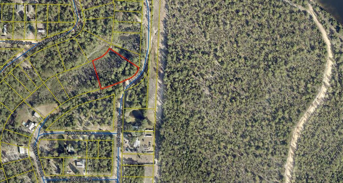 Discover the ideal combination of seclusion and convenience with this spacious 1-acre lot in the Mossy Head area of DeFuniak Springs. Enjoy the tranquility of living out of town while still having the convenience of shopping, dining, and local amenities. Plus, the beautiful beaches of the Emerald Coast are a short drive away.Whether you're planning to build your dream home with ample space or are a builder seeking a promising investment, this property is full of potential. With over an acre of land, you'll have plenty of room to bring your vision to life!Buyer to verify all information, details, and dimensions.