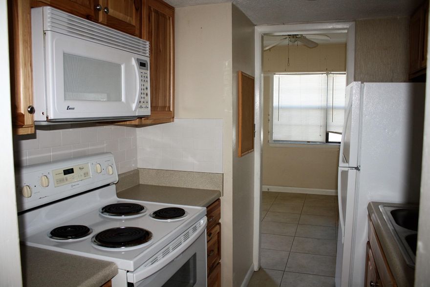 This one bedroom, one bath home is located just a few short steps from the public beach. Best of all, electricity, water, sewer, garbage, and yard care are included in this amazing rental price. The living room is tiled, with neutral walls, and a full length glass sliding door. Plenty of sunlight streams through from the back porch. The bedroom features neutral wall colors, a large closet and tile flooring. There is a full appliance package in the kitchen, which includes refrigerator, dishwasher, stove/oven, microwave, and garbage disposal. Pets negotiable with deposit and owner approval.