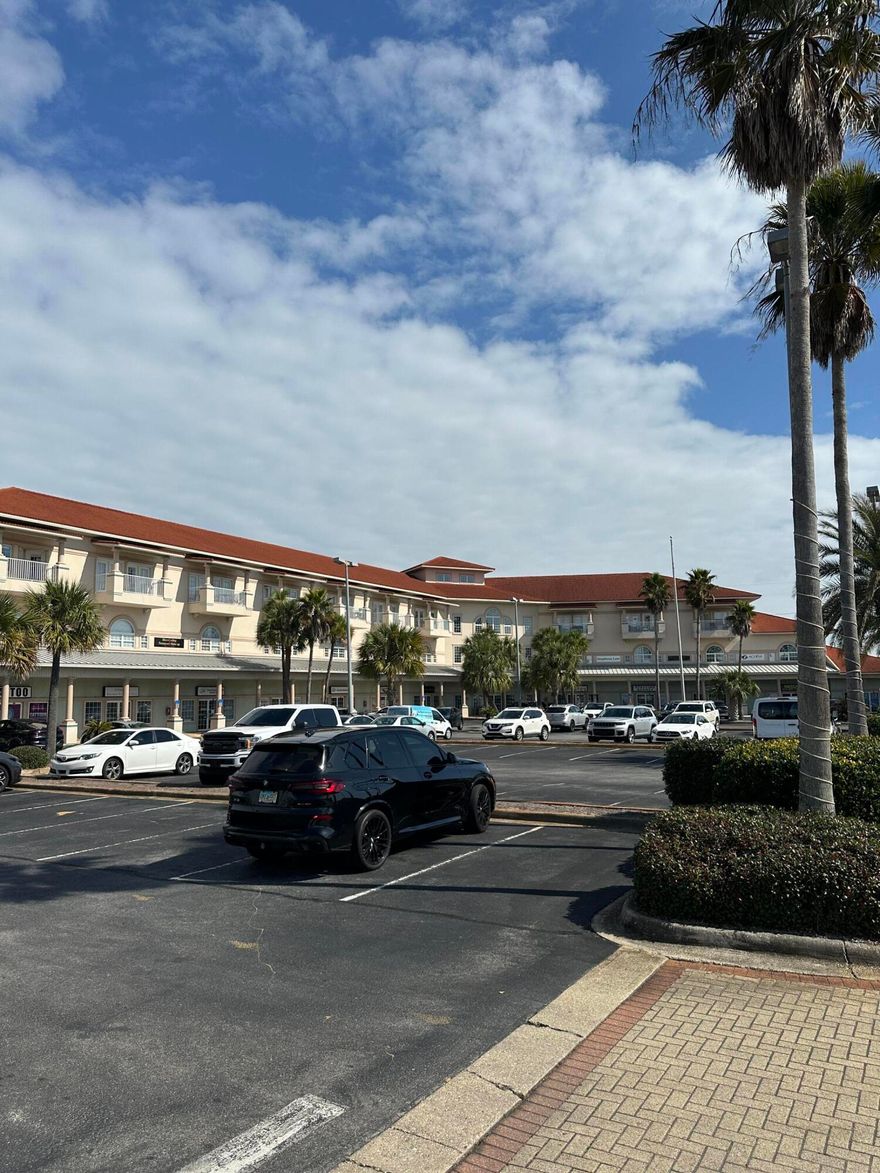 Renovated in 2021, this office space features a welcoming reception area, a bathroom, two spacious offices, and a large, versatile area filled with natural light--ideal for a treatment room, conference, or training room. Located within The Plaza office building, this suite offers a prime location in Destin with visibility on Hwy 98. Situated on the second level at the rear of the building, it includes a private entrance for added convenience.