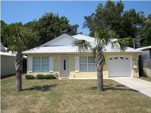 Cute Laguna Beach cottage that is perfect for weekend getaways or rental income. Immaculately maintained. Built in 2010 with 2 BR's, 2 Baths and 1,132 SF. Open floor plan with high, vaulted ceiling in the living room, big dining area and kitchen with stainless appliances and breakfast bar. The guest bedroom has a HUGE walk-in closet. The master bedroom opens to the screened porch. Porcelain tile through entire house so low maintenance. There's even a 1 car garage for storing all your beach gear and toys. Just about 2 blocks to beautiful dedicated Laguna Beach. Convenient to your favorite spots like The Carousel, Thomas' Donuts 30A and Pier Park. Currently used for vacation rentals with heavy bookings. Rental income for 2013 of $18,640. Please call for viewing appointment. Seller is
