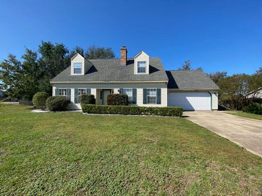 Charming Colonial Style Home! Move in Ready 3BR/2.5BA home is located close to Beaches, Bases and Shopping!  There is a Large Eat-In kitchen with Wood Cabinets, Granite Countertops, a Breakfast Bar and a Garden Window that overlooks the back yard. The large Living Room has a wood-burning fireplace with raised hearth. The Spacious Master Bedroom is on the 1st Floor and has a large closet.  Laundry is near the kitchen and Washer and Dryer are included in the sale. There is a half bath downstairs for guests.  Upstairs, there are two additional bedrooms with charming dormers and a Full Bath with a new Tub/Shower combo.  This home has Low Maintenance Vinyl siding and a hurricane rated garage door. The privacy fenced back yard has a wooden deck, fruit producing pear tree and plenty of room for pets and play!  Some other recent  improvements are:  3-Ton HVAC in 2020  - New Garage side entry door - New Chimney Cap & New Sprinkler timer.  Roof is 2005 and insurance is available.  The Garage has a mini-split HVAC unit to make working in the garage much more pleasant. The garage is NOT included in the square footage.  This is a Wonderful, Move-In Ready Home!  Interior photos will be added on Monday 10/25.