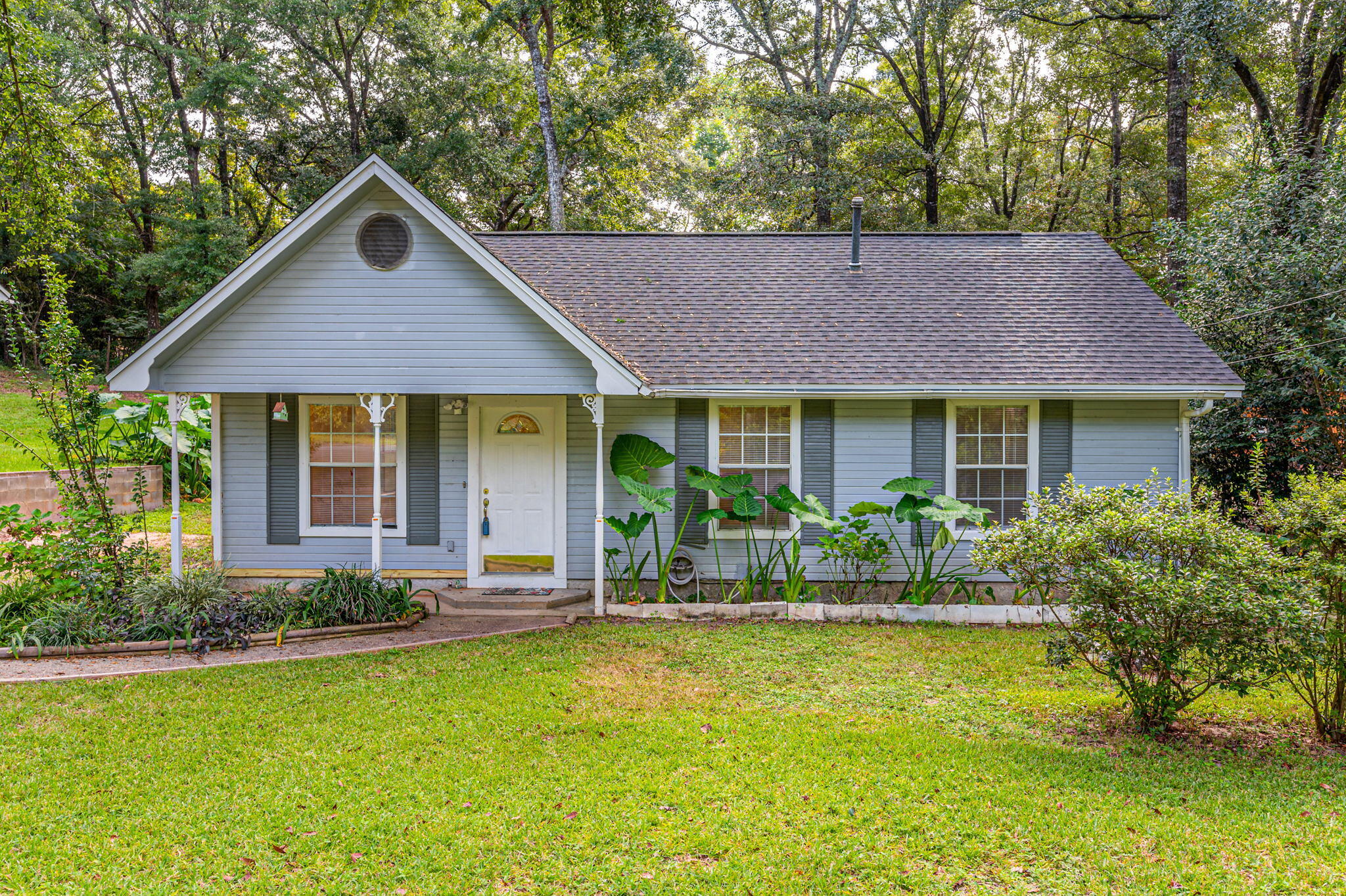NEW ROOF/ AC/ WH - Located in the heart of town on 1/3 of an Acre, This Quaint 3- Bedroom 2-Full Bath Home has been a great rental property since 2003. The Interior has been Updated with Fresh Wall Paint/ Painted Cabinets / New Kitchen Counter Tops / Ceiling Fans / Lighting / Blinds / New Carpet in Bedrooms . The Living Room is Complete with Tile Floors, Cathedral Ceiling and Pass Through to the Kitchen. The Dining Nook Windows Look Out onto the Backyard. The Backyard has Large Wood Deck complete with Gazebo Seating and a Meandering Wood Walkway to the Yard Building. There is a Large Area at the Rear of the Property that Makes a Great Play Area.
