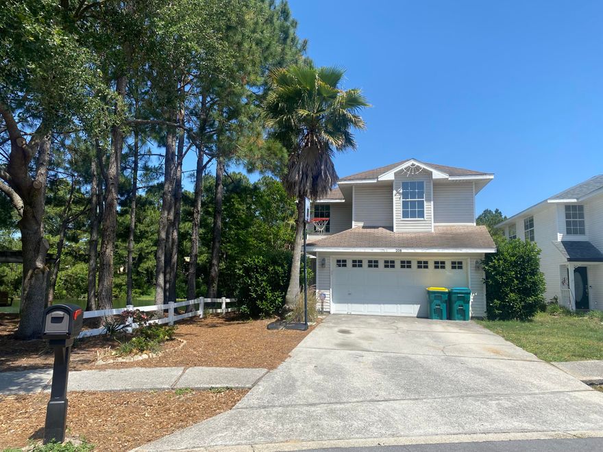 LOCATION, LOCATION, LOCATION! Welcome to the heart of Destin!  This home is located close to the beaches, shopping, medical facilities, churches, and schools. On a pretty, low maintenance LAKE-FRONT lot and adjacent to the common area park!  So much PRIVACY! This home features tons of natural light and offers a screened in patio, and well as an open area...perfect for a bonfire or grilling! The living room/kitchen as well as the Master bedroom also have lake views. The master bedroom also has a large deck overlooking the lake.  Two car garage and large driveway!  1/2 bath on main floor off of foyer and two full bathrooms upstairs.  House is being sold AS-IS! Roof is scheduled to be replaced at end of May.  This is a perfect investment property or primary home!