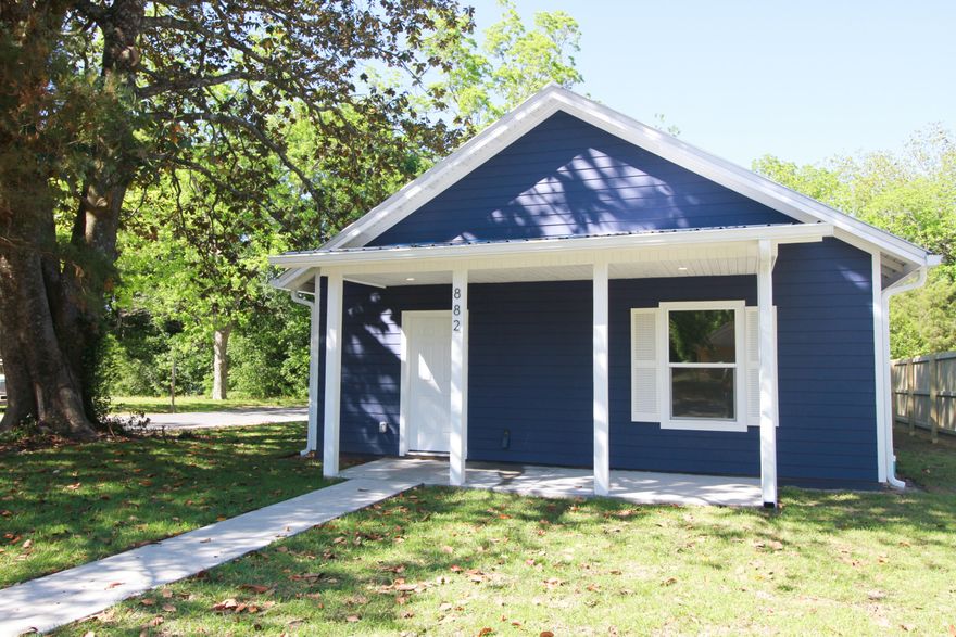 Brand new home, move in ready, completed  May 2025. This home features 2 x 6 exterior walls, 9' ceilings and spray foam insulation. Cozy 3 bdrm, 2 bath, laundry rm with washer & dryer,  kitchen, living & dining area.  Tiled flooring throughout, m/bdrm has a tiled surround walk-in shower, dbl vanity w granite countertops, separate water closet & open closet. The guest bath has a tiled surround shower/tub combination & a double vanity with quartz countertops. The kitchen boasts of granite countertops, upgraded cabinets with soft close doors & drawers, stainless steel appliances, farm sink & gas stove. With a tankless gas water heater, you will have continuous hot water. installed. Many outlets have USB capabilities, recessed lighting throughout the home & ceiling fans in the bedrooms. Buyer(s) are responsible to personally verify all details for property and dimensions. Any information contained in this listing is believed to be accurate but is not guaranteed