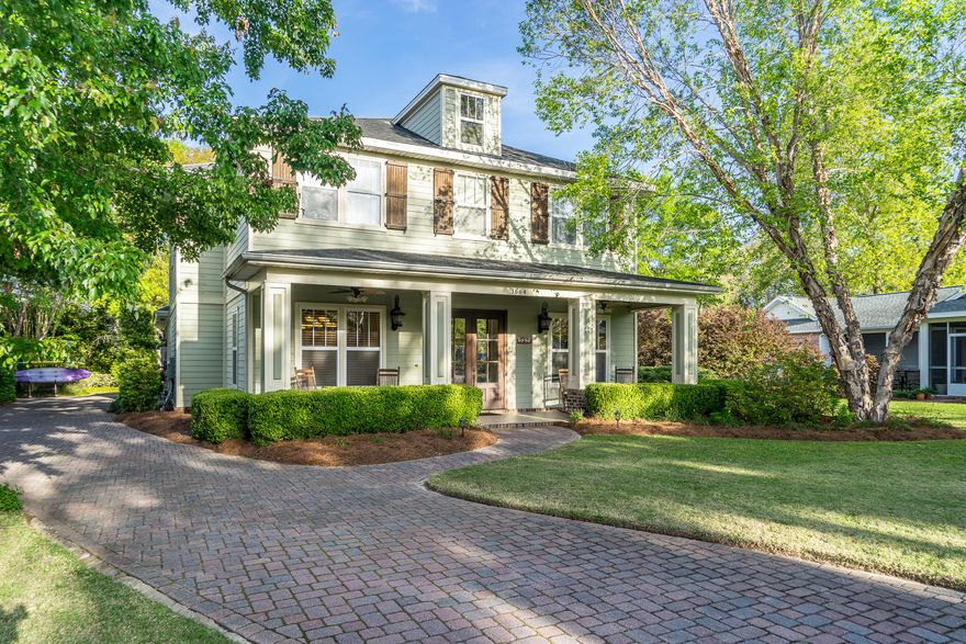 Start your Summer off soaking in your private pool or enjoy a paddle board ride off the community dock into Rocky Bayou! Smell the burgers cooking off of your custom, outdoor grilling area that is equipped with a stainless steel Wolf grill, refrigerator, cooler, and granite counter top serving space. The outdoor area is finished with stone flooring and a screen cover. The back yard has a fire pit and large trees for plenty of shade on a hot day along side a quiet cul-de-sac. From the entry you are greeted by a large front porch area (tiled). The wooden French glass doors invite you inside where you will find a tiled foyer with a sitting area/office on the right and a formal dining on the left (dark, manufactured hardwood).