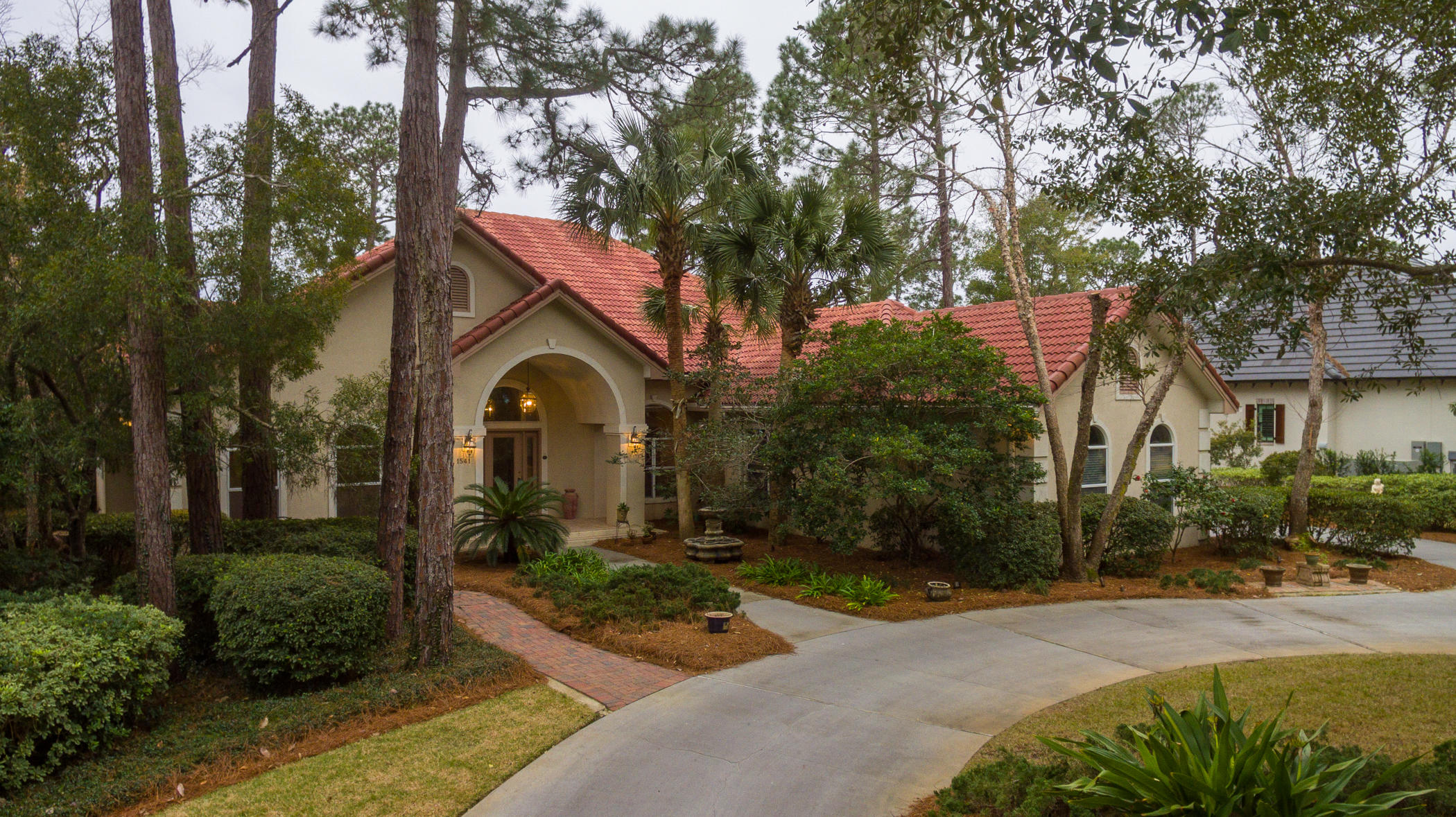 Location, Location, Location! This one level home in the beautiful gated Sandestin Golf and Beach Resort is located along the signature ''Island Green'' hole of the Raven Golf Course. Enjoy beautiful lake and golf course views from the formal living, kitchen, breakfast nook, family room, master bedroom and an additional bedroom. You will no doubt want to entertain friends and family in this 3277 sq. foot home with its wetbar, 440 bottle wine cooler, heated pool with hot tub and the outdoor built-in grill. The large open kitchen has granite counters, two pantries, and Jenn-Aire stainless steel appliances. The master bedroom affords the most luxurious living with a 3-sided fireplace, private sauna, sitting area overlooking the views, and a coffee bar for convenience. The master ensuite..