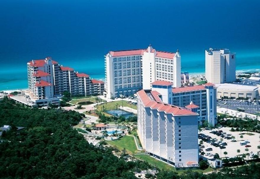 VRBO/ Airbnb $56k for 2018! Completely updated! Turnkey unit. This unrivaled property is being sold fully furnished. This updated condo includes wood plank tile floors, custom closets, updated open kitchen with granite counter tops, custom cabinets, tile back splash, SS appliances. Tops'l Beach and Racquet Resort is a full service gated community with an award winning tennis facility. It spans over 52 acres with three club pools, state of the art fitness facility, 12 lighted courts, conference center and 600' of deeded beach!