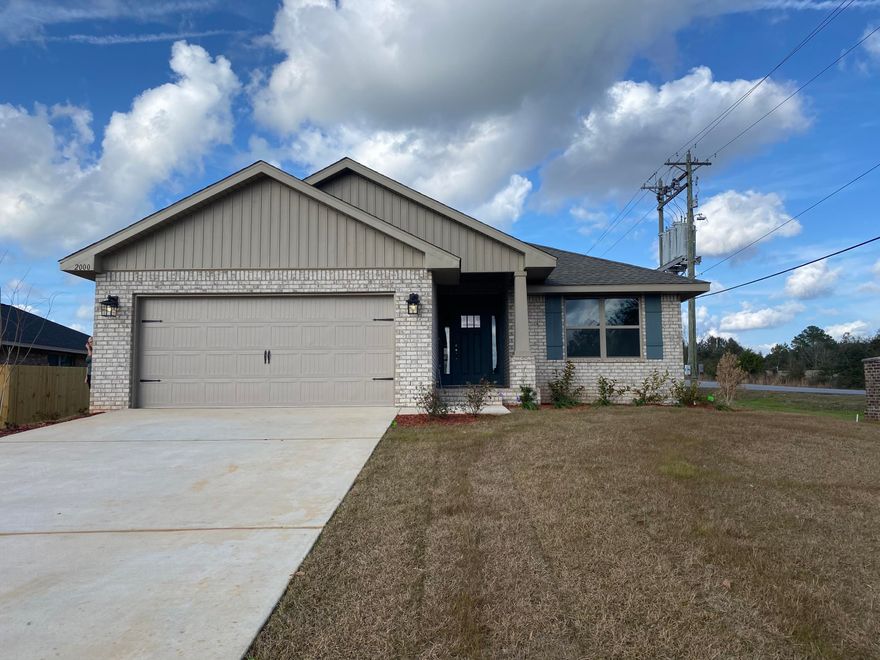 Situated on a corner lot is this beautiful 1820 sq ft Craftsman style 4 bed 2 bath home with a breakfast bar, covered back porch and vaulted living areas. Upgrades include gorgeous LVP flooring everywhere with carpet in the bedrooms, granite in the kitchen and separate shower in the master bathroom with a garden tub. The exterior is 4 sided brick, sodded and professionally landscaped with auto timer sprinklers to keep it all nice and green. The builder also added a 6 ft wooden privacy fence for your backyard privacy. Crestview offers an abundance of dining and a shopping commons area to be complete in 2023. Schools are close and offer bus transportation. Come see!!