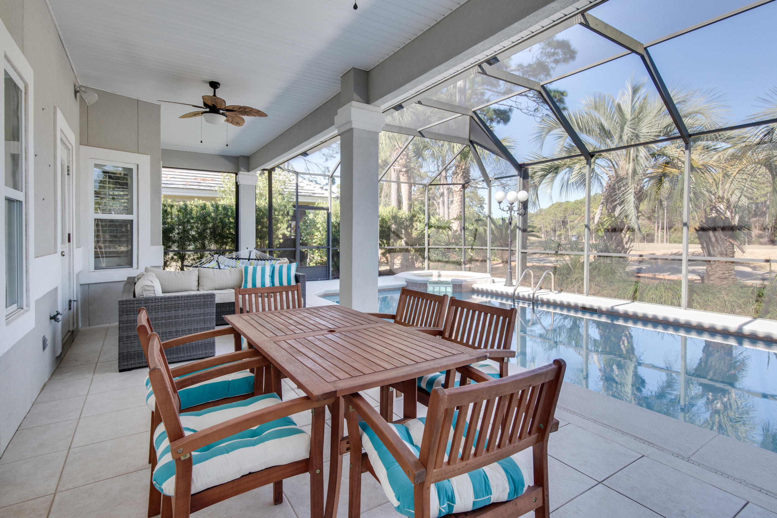 BEAUTIFUL 4 BEDROOM, 3 BATH HOME in the gated golf community of Emerald Bay located on the 11th hole. As you enter the house you immediately notice the soaring 12' & 10' ceilings of the formal dining & living room. The kitchen is totally updated & allows plenty of room for great cooking & entertaining. There is a casual breakfast area & den with fireplace for additional gathering space. The master bedroom is oversized allowing for a private sitting area for peace & quiet as well as his & hers closet. You can access the lanai from the master bedroom as well as the living room & kitchen. A beautiful saltwater pool & hot tub with an oversize decking area for lots of seating creates a large outdoor living area. EVERYTHING has been renovated and updated!!! Just to mention a few: NEW HVAC,
