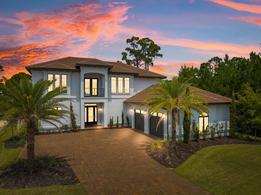 Price Improvement! The Mediterranean meets Miami modern in this luxury coastal hideaway backing onto a peaceful natural pond. This unusual property stands out from the crowd in Finisterre, an exclusive gated waterfront low-density neighborhood. It's a sought-after community for boaters with a community boat dock and leased private boat slips on St. Andrews Bay on the South Lagoon. This custom home is in a quiet cul-de-sac location. A sweeping paved driveway leads to a beautiful entryway with Bevolo gas lanterns and a custom-built front door where, upon entry, you will find a sleek modernist interior with 10' ceilings and dark wood floors lit by multiple tall windows, bringing a natural light setting. The gas-vented ribbon burner wall fireplace, with a 70'' TV screen above, adds a rosy glow to the sitting area, providing plenty of heat in winter months. The avant-garde kitchen has a large island that doubles as a trendy bar at cocktail hour. Color-changing under-cabinet LED lighting adds an eye-catching glow to the iridescent tile backsplash. Pendular designer lighting completes the stylish image. Stainless steel appliances and gleaming black quartz countertops add a practical element. A bonus is the chilled wine refrigerator in the customized walk-in pantry. Dine and entertain beneath another distinctive lighting fixture in the open dining room, enjoying the timeless scenes of nature through the multi-aspect windows. The first-floor master suite with 12' ceilings continues the understated vogue. It boasts an accent wall in the bedroom with abundant natural light. Entering the ensuite bath, shiny chrome fixtures on oversized gray tile walls and trendy designer lighting add an element of style while a walkthrough stand-alone double shower tucked behind the customized oval tub completes the spa-like appeal. A customized walk-in closet doubles as a dressing room with abundant built-in storage. Just off the master suite, living room, and dining area is the covered porch boasting a gas firepit, creating a tranquil outdoor lounge area for entertaining guests or viewing birds and wildlife on the pond. Head up the dark wood staircase to the large media/game room on the landing, where you are greeted with more windows and natural lighting and a great space for relaxing, playing, or entertaining. The built-in wet bar with sink, mini fridge, ice maker and snooker table enhance this fun space. Three more bedrooms, all with walk-in closets surround this space. One bedroom with an ensuite bath is currently being used as an office. The other two bedrooms have a jack-n-jill bath with dual private vanities. An oversized two-car garage with built-in bench and tool wall with a pull-down staircase and generous shelved storage completes the home. Offering security and privacy, this luxury waterfront gated community provides access by boat to beautiful Shell Island and St. Andrews State Park. Sports amenities include pickleball, tennis and basketball courts. Despite the sense of seclusion, the home is within walking distance to the Lighthouse Marina and several popular restaurants, including Captain Anderson's and The Grand Marlin. Treasure Island and Pirate's Cove Marinas are a short drive away, along with public beaches, shops, and grocery stores. A custom specifications list is available upon request as there are too many to add. A few include 2x6 exterior wood framed walls with all thread hold down system for maximum strength, sand finish white stucco, 12'' baseboards with d??cor screwless receptacles throughout, 8' solid core modern interior doors, Rinnai tankless gas water heater, built-in whole house audio system, Ring doorbell, impact dual-pane low-E glass windows, manual generator transfer switch setup at interior, 40 circuit panel in garage with 50 amp generator inlet at side yard. Sprinkler system, custom landscaping, zoysia sod and large palms. Mounted TVs convey with sale. Buyer to verify all data and dimensions. Seller is offering OWNER FINANCING up to 75% at 6% interest with 3 year balloon with acceptable offer.