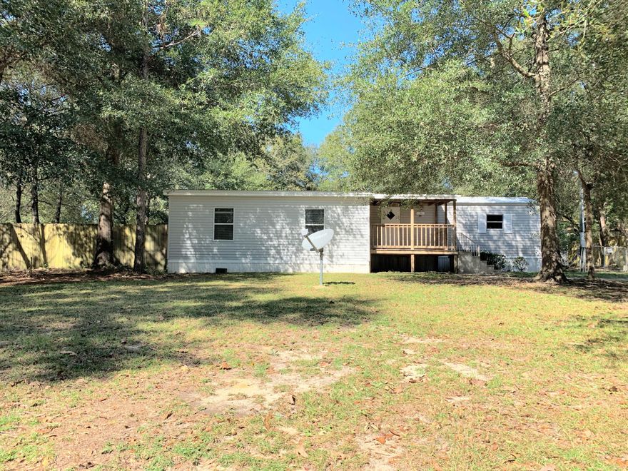 This 2 Bedroom 1 Bath mobile home sitting on almost half an acre is a steal! Home has an extra space beside the master bedroom that could be used as a baby nursery or home office. You could possibly even turn it into a bigger laundry room or 2nd bathroom. The back yard is completely fenced in and has 2 utility sheds that will convey. The larger utility shed has power. Enjoy your morning coffee on either of the nice covered decks. Buyer to verify all measurements.