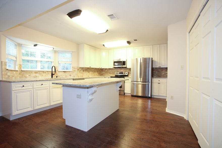 Wonderfully renovated home located in the Bluewater Bay area! This home offers two stories, four bedrooms, two full bathrooms, one half bathroom, and 1,975 square feet of living space. The upgrades done on this home are numerous. Beautiful, dark hardwood flooring has been installed throughout, as well as tile, carpeting, tile, cabinetry, paint, granite countertops, and stainless steel appliances. The kitchen offers a lot of space, perfect for having company over. Still some touch-ups to do as well as some vinyl siding to install on back of house..