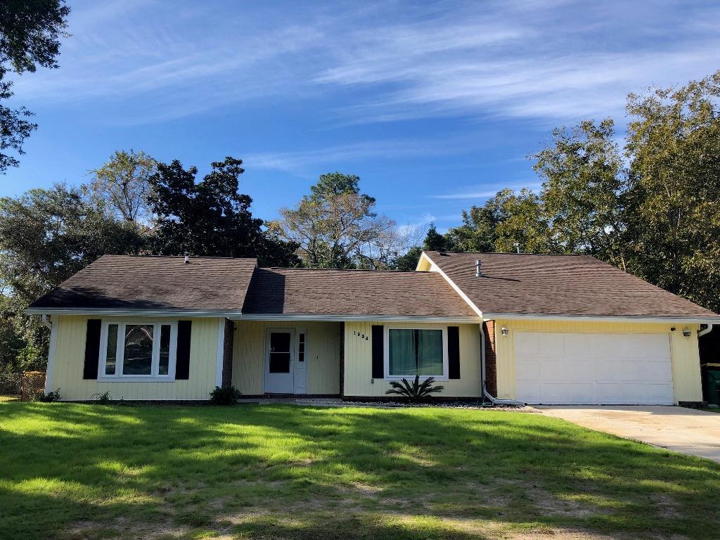 Centrally located home in Niceville on private lot backing up to city property. The split floorplan features a living room, dining room galley kitchen and good sized bedrooms. The fully fenced back yard offers a convenient yard building as well as a large deck for entertaining, a fire pit area and a screened porch. Recent updates include a 2011 roof, impact windows, storm doors, laminate flooring, new insulation and a tankless water heater. This home is move in ready just in time for the holidays!