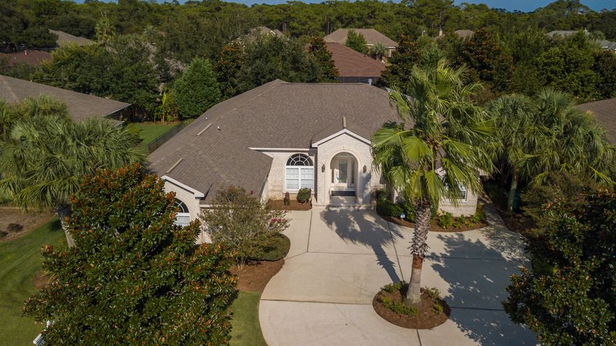 BACK ON MARKET--JUST IN TIME FOR THANKSGIVING! Luxurious, executive living in this waterfront, gated community located just south of Hwy. 98 on the Intracoastal Waterway. Built by Tempo Homes. This beautiful home is a soothing palette of neutrals awaiting your decorating ideas! Open-concept floorplan...crown-mold throughout...gas fireplace...pocket doors...custom windows ...Bali blinds...professionally landscaped...custom lighting...Corian countertops...tile flooring...the soothing sounds of a trickling fountain are a highlight of the travertine patio. Many desirable features are not readily visible to a prospective buyer: premium brick exterior...80-gal hot water heater...shore power available...additional lighting package in garage...floored attic...screene