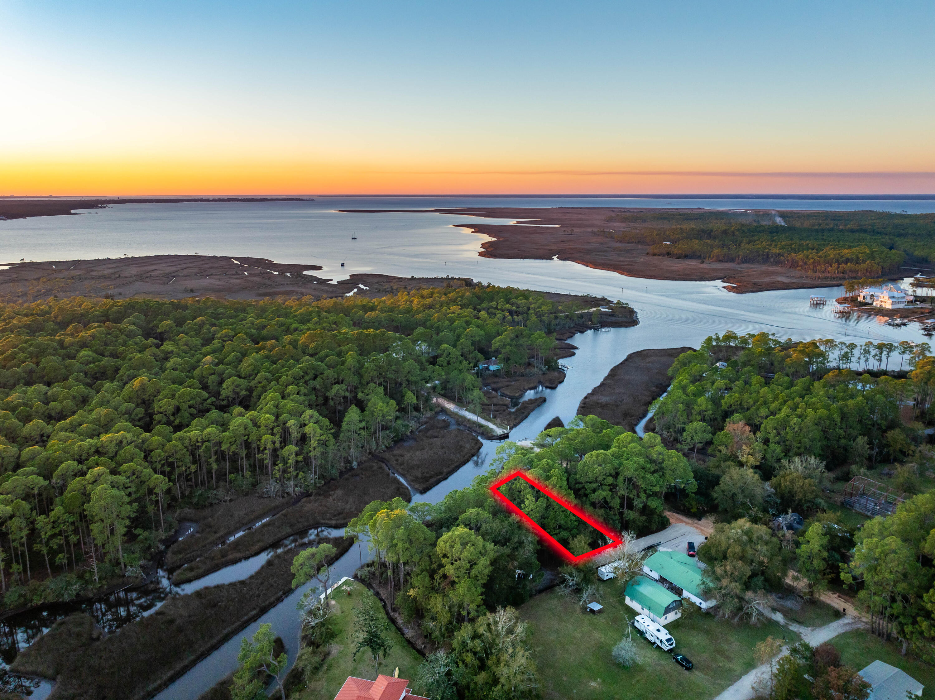 An exceptional waterfront property in Santa Rosa Beach is now available. This western-facing lot offers stunning panoramic views of Hogtown Bayou, paired with deep-water access that makes it a true haven for boaters.Located just moments from Cessna Landing, this lot provides easy access to the beaches and the vibrant lifestyle of 30A's west end, including Gulf Place, Shunk Gulley, and other local favorites. Whether you're looking to build your dream home or secure a prime investment, this property delivers on location and lifestyle.Key features include:Unmatched Hogtown Bayou viewsDeep-water access for boating enthusiastsUtilities available: water, sewer, and electricClose proximity to beaches, dining, and shoppingCreate your own piece of paradise and enjoy the best of waterfront living in Santa Rosa Beach. Survey available upon request.

Experience the Charm of Santa Rosa Beach Waterfront Living