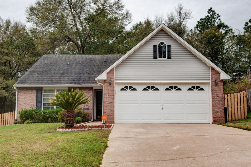 This home has it all!!! Close to the bases, SOUTH of I-10 AND 4 BEDROOMS!!! You'll love this home with plenty of room to live. The well maintained tiled kitchen has plenty of countertops and even an eat in nook. Enjoy the roomy feel of your family/dining room with it's fireplace and beautifully laminated wood flooring. The master bedroom is on the first floor, and you will enjoy plenty of closet space, and a master bath with double vanities and it's own separate shower and tub. Also on the main floor is one of the extra bedrooms and it could work as an office too. The other two bedrooms and full bathroom are upstairs. The wide open fenced back yard and patio is so inviting and ready for you to grill and entertain. Make this your home today!