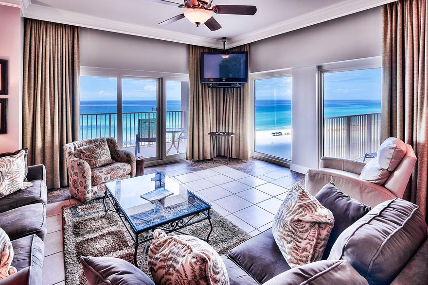 Boasting upgrades throughout, this Gulf front Beach Manor condo, captures incredible views from its two waterfront master bedrooms, two covered balconies and open living area. Sliding doors and fixed pane windows are accented by thick crown molding also used to create seamless cornice boxes for the custom drapes. Tile floors carry throughout the open living areas and into each bedroom and upgraded baths. The east master features unobstructed gulf views and shares access to a balcony with the living area while the west master features gulf views beyond its own private balcony. Wood cabinets and granite counters found in both the kitchen and baths reinforce the cohesive design scheme.