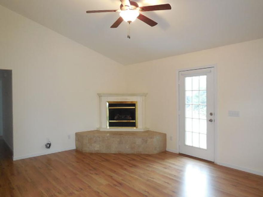 Welcome Home with this wonderful 3/2 on a quiet cul-de-sac near the heart of Defuniak Springs! Walk into the welcoming living room with waulted ceilings, a beautiful fireplace, and wood laminate flooring. The open floor plan leads into a fantastic kitchen with tile flooring, a long breakfast bar as well as a dining area also with wood laminate flooring. Stainless steel appliances include a refrigerator, oven/stove, dishwasher and microwave. There is also a laundry closet already with a washer and dryer! The master bedroom has a private outdoor patio. The master bath includes a double vanity, a tub with tile surround and a separate shower. The backyard is one of the largest in the neighborhood and features two patios and a screened porch. The garage is 2-car with pull-down stairs.