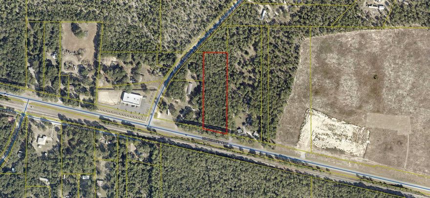 Aprox 2.2 acres with 200 ft of frontage on Hwy 90 West. zoned General Commercial. This rectangle shaped property is currently being surveyed and will be  updated asap. Its wooded with  a assortment of trees including pines.