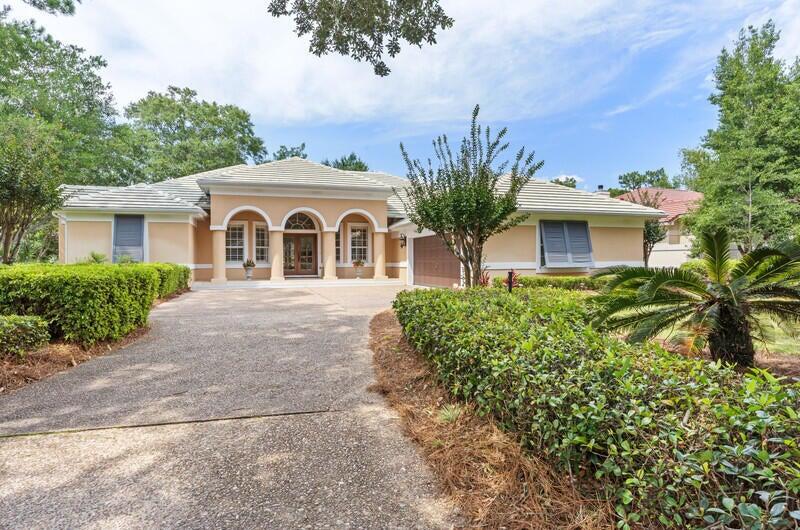 This delightful single story custom home has 3 beds, 2.5 baths, and an office that could easily be used as a 4th bedroom. Entering through the beautiful double doors, you'll be greeted by an open-concept layout including a formal dining room, perfect for hosting gatherings. The spacious master bedroom includes seating area and French doors accessing the lanai and private pool. The master bath includes a beautifully tiled soaking tub, separate shower, double vanities and a dressing area. On the opposite side of the home are two additional bedrooms. The bright kitchen has stainless steel appliances and a breakfast bar. It flows into the family room which features built in cabinetry, a gas fireplace and a lovely chandelier. Plantation shutters cover windows and doors. Head out through any of the various double doors to the screened lanai for a swim in the saltwater pool. Mature landscape allows for privacy while enjoying summer fun. Oversized side entry garage allows for plenty of room for your cars and golf cart. This home is located within walking distance to the Raven Golf Course and Baytowne Golf Course. Sandestin Golf and Beach Resort features more than seven miles of beaches and pristine bay front, four championship golf courses, 15 world-class tennis courts, a 226-slip marina, a fitness center, spa and celebrity chef dining. Shop, dine and play at the charming pedestrian village, The Village of Baytowne Wharf and more. Inside the gates of the resort, residents enjoy a balanced lifestyle of high-class living, spanning the 2,400 acres from the beach to the bay. Everything within the gates of the resort is accessible by golf cart or bicycle. The entire resort is interconnected by miles of pedestrian, bike and golf cart paths that weave through groves of live oaks, meandering past natural lagoons, fountains, man-made lakes, and meticulously landscaped fairways.