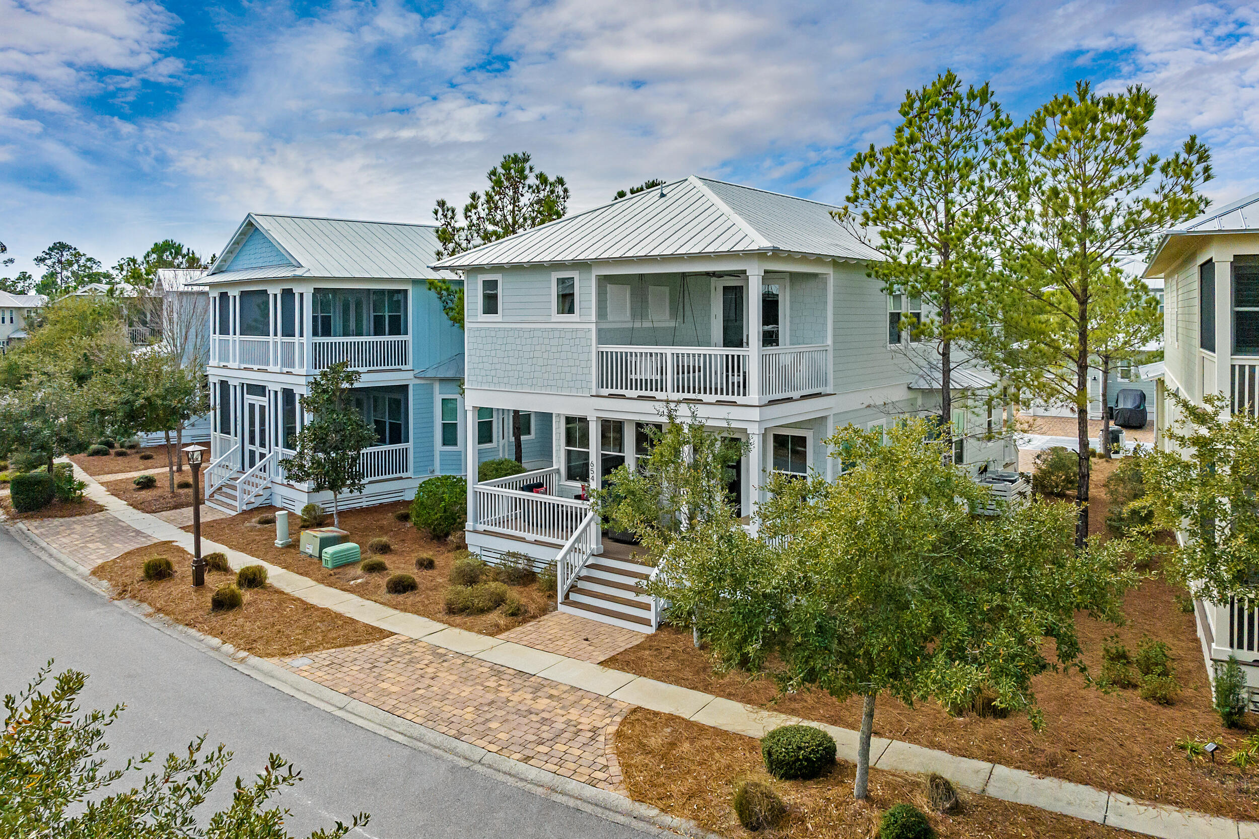 Welcome to your dream getaway, where comfort, style, and convenience come together in perfect harmony! From the moment you step onto the spacious front porch, designed for both lounging and dining al fresco, you'll feel right at home. Inside, the open-concept kitchen and living area is thoughtfully laid out for full family fun, making it the heart of the home. A newly installed built-in shelving unit adds both function and charm, providing the perfect place to showcase your favorite travel mementos, treasured keepsakes, and audio/visual setup. The beauty of this home continues with its refinished pine floors, which gleam like new and add warmth to every step. Thoughtfully positioned just 210 steps from the beloved Gathering Pool, this home also sits on a wider lot than most, offering additional space and privacy.
With two equally fantastic owner's suites, each featuring dual sinks, separate tubs and showers, and spacious closets, comfort is a given. One of these suites is conveniently located on the first floor for easy access. Upstairs, you'll find a delightful Beatles-themed twin rooma whimsical retreat for kidssituated just off a cozy loft space, perfect for unwinding. Another guest room upstairs provides a quiet escape, complete with access to a nearby hall bath.
Finally, the relaxing porches off both the first floor and upstairs owner's suite create serene spaces to enjoy morning coffee, evening cocktails, or a quiet moment under the stars.
All of this and located within the coveted NatureWalk at Seagrove community!  NatureWalk offers a lifestyle of unparalleled convenience and recreation with its array of top-notch amenities and prime location. Residents enjoy access to a community pool, fitness centers throughout, and scenic trails, perfect for outdoor enthusiasts. The community also features a sports court, playgrounds, and a Gathering Place for social events. A unique highlight is the path through Point Washington, providing a scenic and quick five-minute bike ride to the stunning beaches of South Walton. Just a short distance away are the renowned beachside communities of WaterColor and Seaside, where you can explore charming shops, dine at award-winning restaurants, and enjoy the beautiful beaches of the Emerald Coast. NatureWalk at Seagrove truly combines the best of coastal living with the comforts of an amenity-rich community.