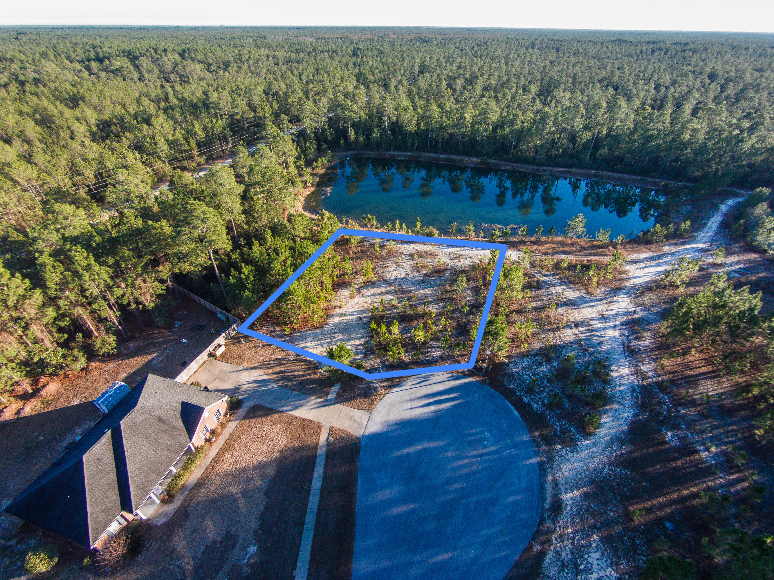 Enjoy beautiful views from this lake front homesite in your new dream home. Situated within Windswept Estates, a gated, golf-course community conveniently located close to Hwy 331 for quick access to the Beaches of South Walton, Destin, Niceville, Eglin Air Force Base and so much more. Imagine a 750-acre, master-planned community nestled in the quiet surroundings of Freeport, Florida. The natural topography provides a sense of privacy between the 401 homesites and the well-maintained golf course. With nearly 3/4 of an acre you can design the home of your dreams. Windswept Estate amenities include: Windswept Estates 18-hole golf course, a large swimming pool & clubhouse, 2 tennis and basketball courts, and a safe playground facility.