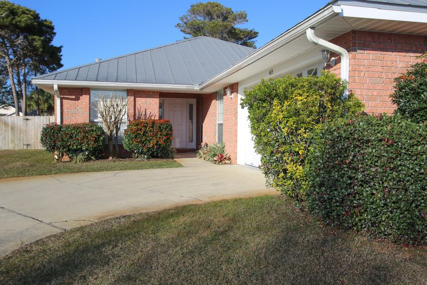 Don't miss out on this opportunity to live just a few blocks from the beach. This 3 bedroom 2 bath house is situated on a large corner lot with high elevation and many updated features. This is one of the few houses in the subdivision with a metal roof which was installed in 2005. Updated features include: New gas hot water heater (2015), new A/C (2015), new refrigerator (2014), electric gas top stove (2014), new carpet (2015), new cabinets and granite counter tops (2014), 10 X 20 screened in porch which was tiled (2015), and a new water pump for the lawn system (2014). There is a private community pool in the subdivision as well. It is a must see!!!! *HOUSE COMES UNFURNISHED BUT FURNITURE AND GOLF CART ARE NEGOTIABLE*