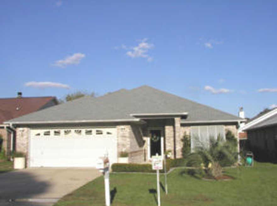 This delightful brick home would make an excellent starter home or for someone looking to downsize. It is conveniently located near Grocery Stores, Pharmacy, schools and restaurants; and has a public bay access just down Joybrook to the end of the street. The 14 foot ceilings in the living room features plant ledges and lends itself to the open feeling of the home. The Master suite features two walk in closets opening into the master bath with two sinks a garden tub and separate shower? The floor plan is a split bedroom for your privacy.The kitchen has a center island and is open to the eating area. This is an all brick home, and double garage. It also has a porch with vinyl windows. Many items have been replaced, please view our list under