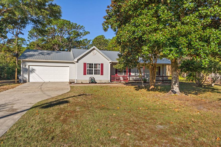 Don't Miss Out On This Adorable 3BR | 2BA Home In East Navarre That's Situated On A Half Acre Lot With No HOA! This Split Floor Plan Offers A Spacious Living Area With Vaulted Ceilings That Is Perfect For Entertaining As Well As The Large Backyard With Screened In Porch! Not To Worry...All Of The Big Ticket Items Have Been Recently Replaced: New Roof (March 2022), HVAC (2019) & Tankless Water Heater (2020). This Home Has Been Freshly Painted Inside & Out.  Inside You'll Find Hardwood Flooring In The Living, Dining & Hallway, New LVP Flooring In All Bedrooms, & Tile In Both Bathrooms & Kitchen, Galley Kitchen Equipped With Stainless Steel Appliances & Much More!  Home Is Conveniently Located Just Minutes Away From Nearby Shopping, Hurlburt Field Air Force Base & Navarre Beach! Call Today!