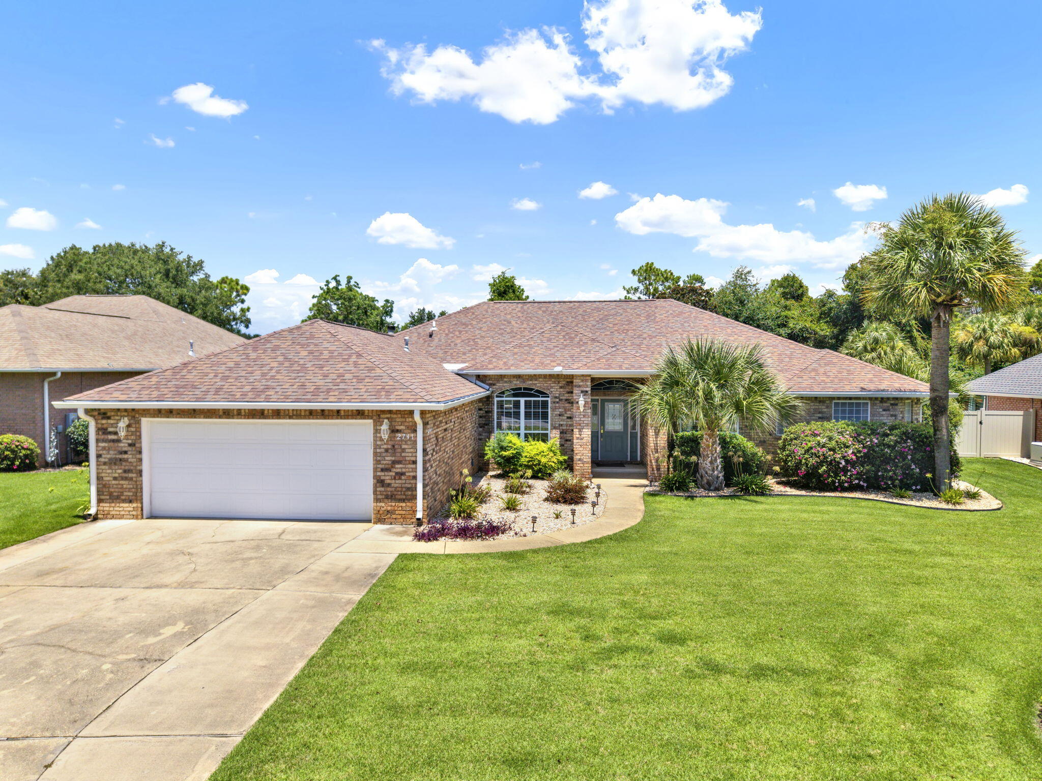 Welcome to your dream home in the highly sought-after Creeks Edge neighborhood of Navarre! This stunning 4-bedroom, 3-bathroom, 2,905 square foot residence combines luxury, comfort, and functionality with breathtaking views of the Hidden Creek Golf Course.Step inside to find a spacious open-concept living area with soaring ceilings that create a bright, airy feel throughout. The beautifully updated kitchen is a chef's delight, featuring granite countertops, stainless steel appliances, under- and over-cabinet lighting, and an abundance of cabinets and counter space--perfect for entertaining or everyday living.The oversized master suite is a private retreat, complete with a trey ceiling and a separate office or sitting room overlooking the pool.... Enjoy year-round comfort with an independent HVAC system just for the master suite. The luxurious ensuite bath offers two large walk-in closets, a double vanity, a whirlpool tub, separate shower, and a private water closet.
A cozy den provides a secondary living space with gorgeous views of the pool and golf course, highlighted by a wood burning fireplace, tray ceiling, and granite-topped cabinets, an ideal spot to unwind or host guests.
Step outside to your enclosed patio and pool area, featuring a heated pool perfect for relaxing or entertaining while enjoying serene golf course views. The beautifully maintained yard is supported by a well-fed sprinkler system and includes a convenient storage building.
Additional features include all-brick construction, a centralized vacuum system, a 2022 HVAC system, and a 2018 roof for peace of mind.
Don't miss your opportunity to own this exceptional home in one of Navarre's most desirable communities. Schedule your private showing today.