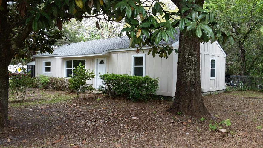 Affordable and Adorable, recently remodeled, 2bd/1b Craftsman home maintains it's Southern Charm on an extra large corner lot! Mature trees provide beauty and shade while relaxing and sipping fresh mint tea on the large attached screen porch. New Ac/Heat system with Ultra-Violet protections for Allergens installed in 2013. Windows, Roof, and tile flooring all replaced 2002'-2004'. Exterior Hardy Board and new Kitchen installed in 2011' with all appliances conveying with the sale of this home! Your new home has a ''Pet Door'' allowing easy access into the fenced yard; an attached Carport, In-ground sprinklers, and a lawn pump replaced in 2014'. The Shed in the backyard is ''As-Is'' and can easily convert into a green house for the home gardener! This is a ''Must See'' home!