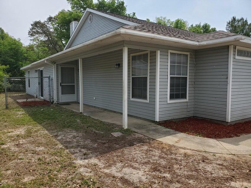 Updated 3 bedroom and 1 bath townhome with 1159 sq ft close to the beaches, schools, restaurants, and shopping! This townhome features a corner lot that is fenced, a one car garage, double paned windows and a Newer dimensional shingled roof (May, 2023). The interior of the home features new luxury vinyl plank throughout, a large kitchen with a peninsula that seats 2-3, and stainless and black appliances! The appliances include a built in microwave, slide in stove/oven, dishwasher and refrigerator. The home has an open floor plan with the kitchen, dining, and living room in a great room! The living room has a fireplace and sliding glass doors to the open patio and side yard. There are two bedrooms and a full bath with views of the back yard. In addition there is a third guest bedroom. The home has a new electrical panel (2023). There is no popcorn, some new lighting, and raised panel doors. This is a great investment property or owner occupant home! Buyer to verify all dimensions and information.