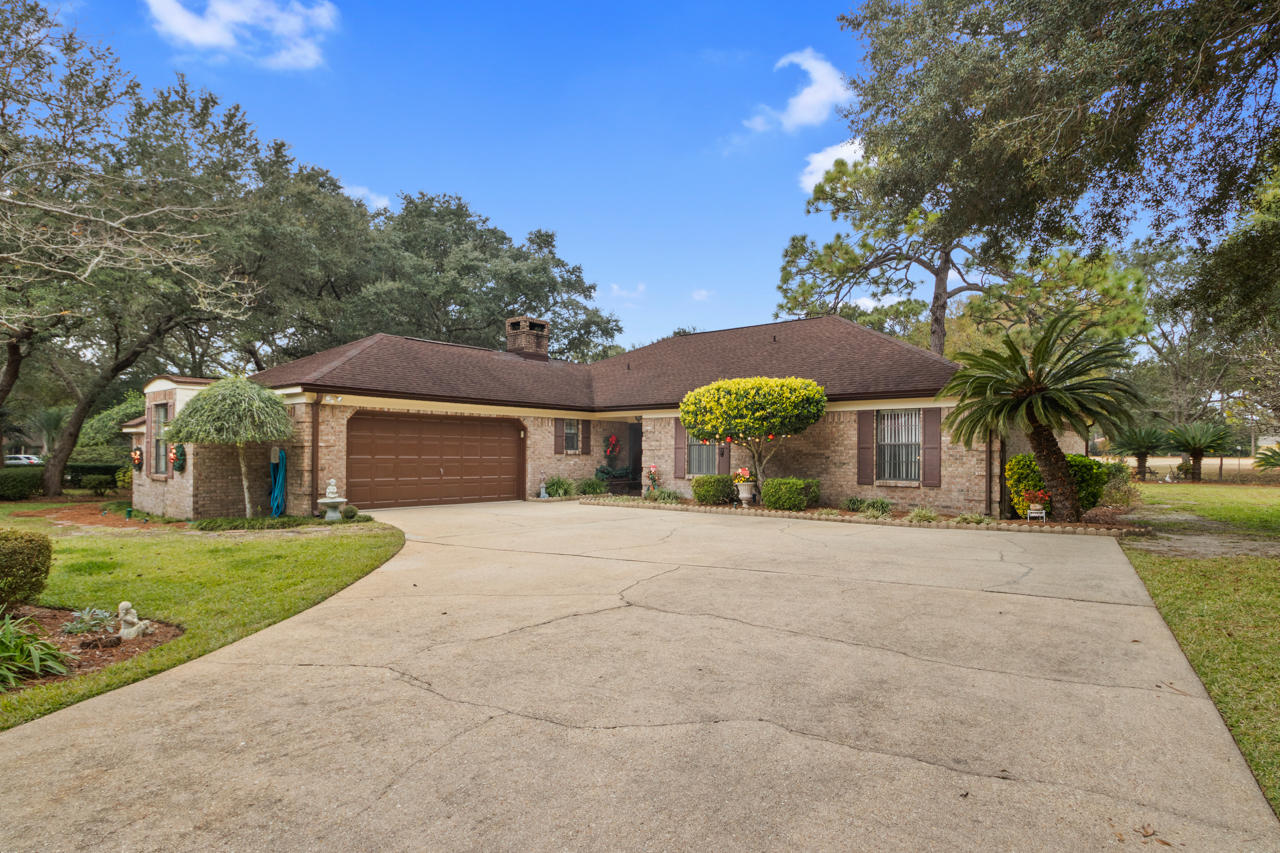 Extra large corner Rocky Bayou lot with beautiful landscaping overlooking the Rocky Bayou Golf Course, one of the finest in Niceville! This 4 bedroom 2.5 bath all brick ranch home with side entry garage and room for a workshop! Upon entering through the double front doors you are greeted with an ample sized foyer overlooking the first living room with an exit to the expansive screened-in porch with views of the half acre yard and golf course. Surprisingly there are 2 living areas, one off the kitchen with a wood burning fireplace & wet bar. This is a fantastic layout as many are looking for two places to ''play''. The four bedrooms are all spacious with large closet space and neutral walls. The master bedroom has plenty of room for a king sized bed. dressers. There are two large well lit closets and a master en suite with two sinks separate from the shower and toilet area. The other 3 bedrooms share a hall bath with walk-in seated shower space. It is easy to see that this home has been well maintained and well cared for. This home has it all and is located on one of the largest lots in a sought after community!
The seller is motivated and is now offering a $5,000 credit towards buyer's upgrade costs with an accepted offer!