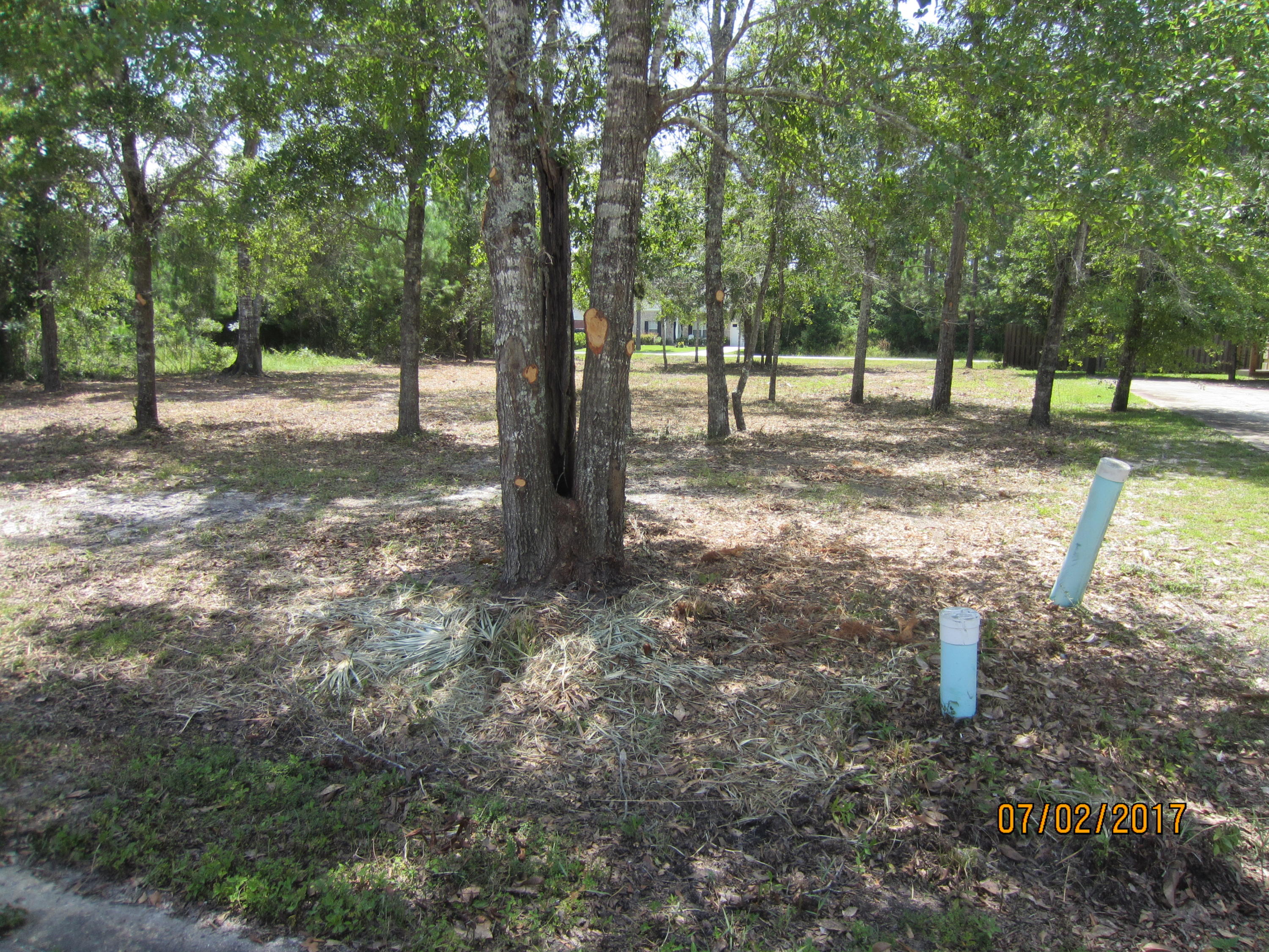 Commercial lot in a developing office/Commerce park just North of the 331 Bridge. Excellent location for multiple uses. The commercial park offers underground utilities, paved road with curbing, beautiful ornamental street lights, and a selection of native mature trees. Strategically located only minutes from the Beach communities that span 30A. Excellent investment opportunity or development for your immediate needs. The owner is a real estate broker in the State of Florida.