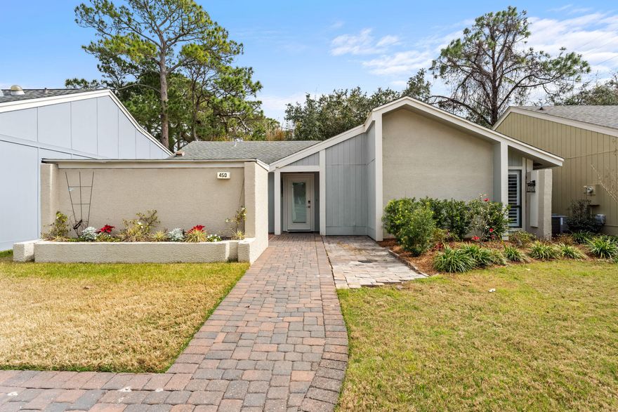 This remarkable home has undergone an incredible transformation by talented renovation and design experts. Enhancements include full interior painting, custom baseboards, double French glass panel doors in the kitchen, all new flooring, shiplap installed in bedrooms and kitchen, new upscale lighting and ceiling fans, new low profile stainless microwave, new draperies, plantation shutters in owner's suite, Nest intelligent thermostat, Schlage remote door lock, all door hardware updated, refaced kitchen cabinets and fireplace. Level 4 granite in both baths, cabinets in the laundry area, and ALL new furnishings. Warmth and coastal elegance are evident throughout this fine residence and ''move- in ready'' is a vast understatement. Schedule your private viewing today!