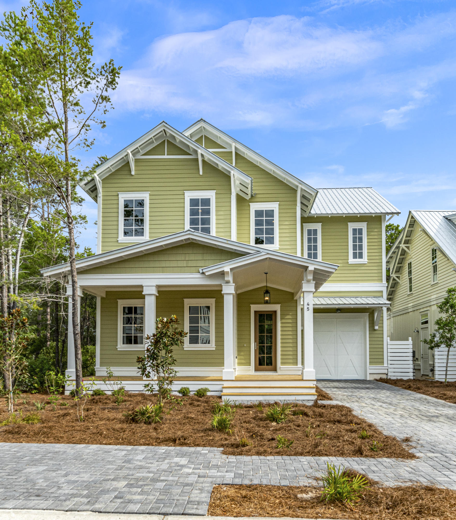 Stunningly Beautiful and Uniquely Private! This 4 bedroom home backs up the Point Washington State Park and is just a short stroll to the Beaches of 30A. No expense was spared on finishes which include white SOHO cracked glass tile fireplace, chevron patterned grigio kitchen backsplash, gold pulls, faucets, light fixtures, and craftsman styled trim. The downstairs walls are lined with windows and transoms that bring the outdoors inside. Perfect for entertaining, the kitchen features a large island, double stacked cabinets with glass doors, and gas range. The construction materials are superb and feature impact resistant windows, foam insulation, mitered siding corners, and custom made angle brackets and porch beams,. Lakeside is located in Blue Mountain Beach and has a swimming pool and