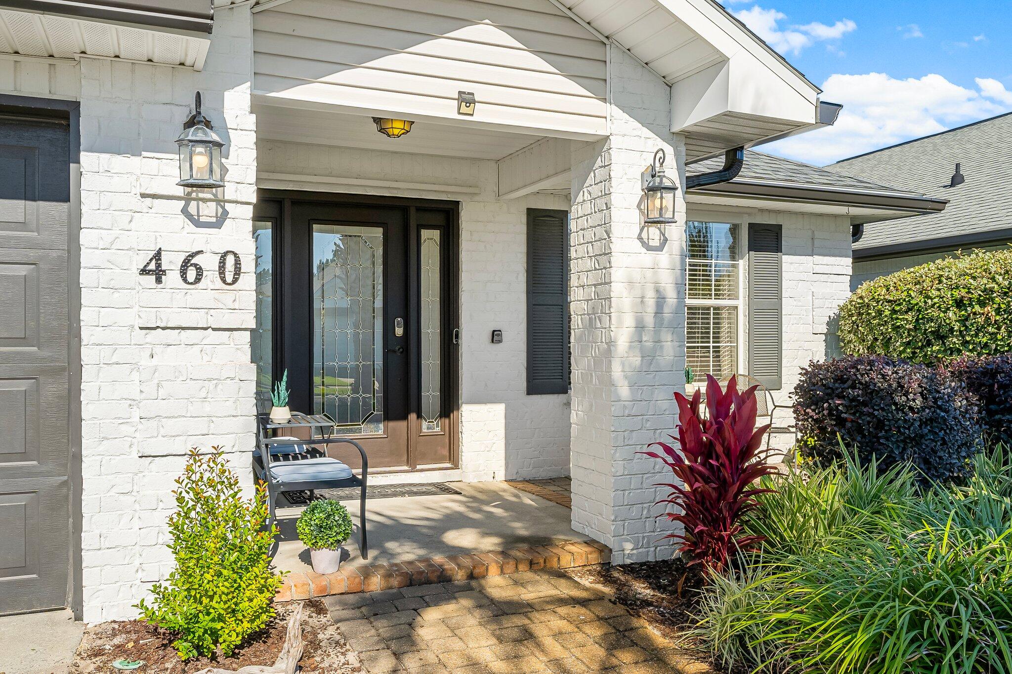 Just freshly painted incl trim. New Floors as of 12/24! Beachside Gated com with 320' of deeded beach. 4 bed/2 bath with open floor plan, completely remodeled, decorated and painted exterior Coastal White Brick. Positioned in the premium South end of the community with the added privacy of a preservation in the back. Coastal colors in the interior, shiplap accents and beachy decor. Fully furnished & ready to be a vacation rental, second home or primary home. Features,  (LVP) flooring throughout, tile in bedrooms & Guest Bath. Open Kitchen has Granite Countertops, breakfast bar, coffee bar, tile backsplash, SS Fridge, Dishwasher, farmhouse sink & Gas Stove with Jenn-Air Hood. Master suite has large walk in closet &  bath with dual vanities. This home brought in $107,147.62 in rentals in