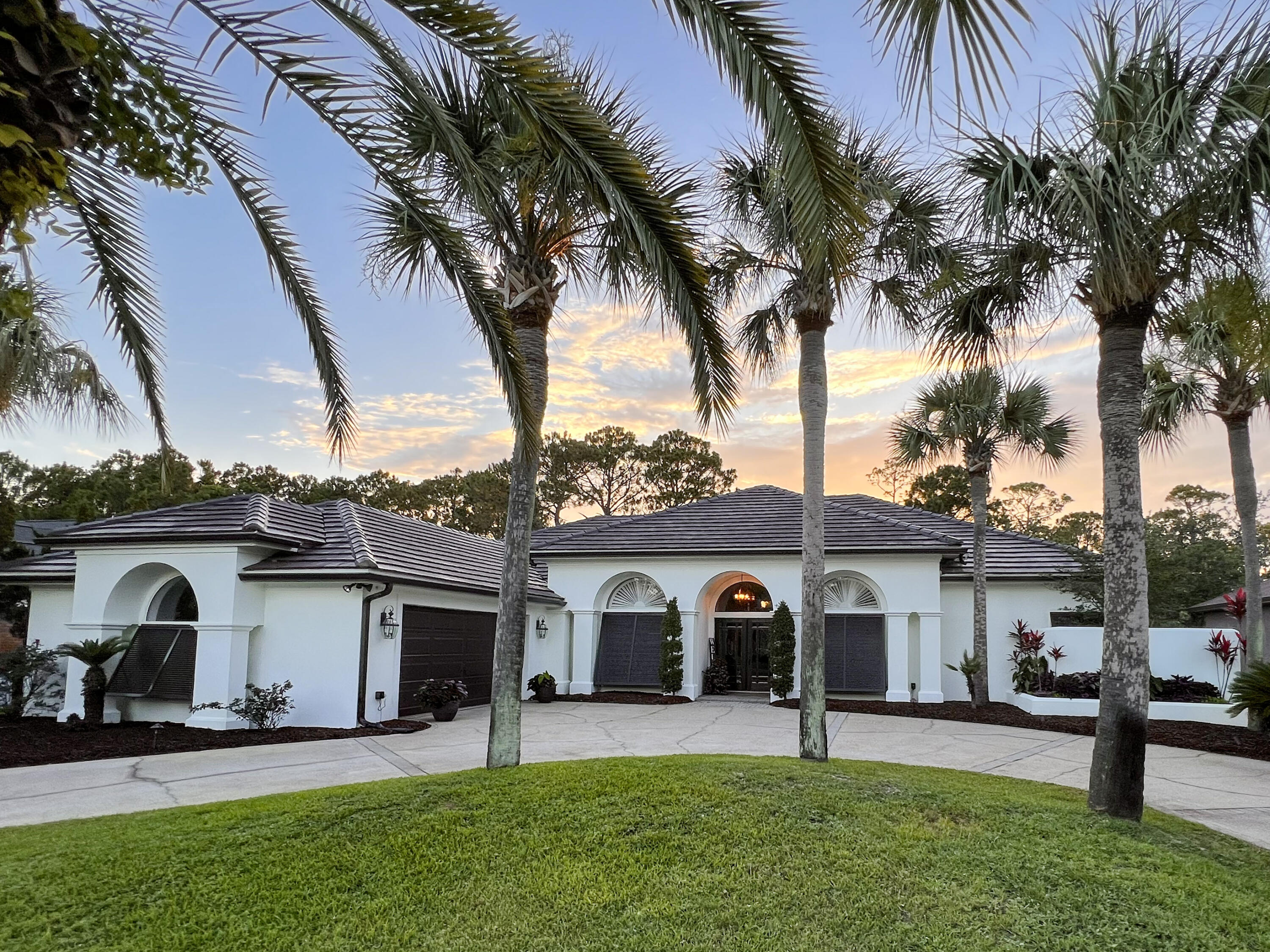 Your PRIVATE oasis awaits..This beautiful, well maintained home is located in the Emerald Bay golf course community. The open floor plan and  expansive outdoor living space is ideal for gatherings & entertainment. Travertine + hardwood floors, plantation shutters, & 12' ceilings enhance the designer interior.Just minutes away from the beautiful white sandy beaches, amazing restaurants, shopping & more! This home is a MUST SEE!