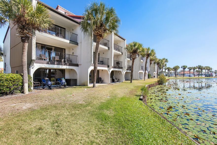 COASTAL LUXURY AWAITS - Beachside Golf Villa by the Gulf of Mexico. Welcome to your dream retreat! This stunning 2-bedroom, 2.5-bath golf villa offers 1,330 square feet of beautifully designed living space, just steps away from the Gulf of Mexico.  Step onto your private deck and take in the serene beauty of the golf coarse, where a picturesque lily pond shimmers in the sunlight.  This tranquil oasis is a haven for coastal birds, from graceful herons to playful egrets, creating a peaceful nature filled retreat right outside your door.  Whether you're sipping your morning coffee or unwinding with a sunset drink, the soothing sounds of nature and the gentle Gulf breezes make this the perfect place to relax and recharge.  Enjoy breathtaking sunset views and a resort-style lifestyle with exclusive amenities, including golf, tennis courts, multiple pools, shuffleboard, and basketball. Whether you're looking for a permanent residence, vacation getaway, or investment property, this villa offers the perfect blend of relaxation and recreation.  With direct beach access and world-class golf at your doorstep, this is Gulf Coast living at its finest. Don't miss your chance to own a piece of paradise!  Schedule your tour today. Seller offering $2000.00 credit to buyer at closing to replace carpet. (BUYER TO VERIFY ALL MEASUREMENTS)