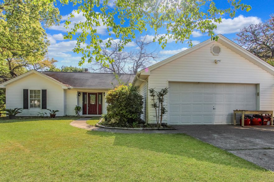 3 Bed, 2 Bath Vibrant Valpariso Home.The style of this large, sun-filled Valpariso rancher doesn't stop when you step through the elegant front door with sidelights. Entering your new living room, note the hardwood floors and exposed-brick corner fireplace. The cozy living room transitions to a tiled kitchen complete with breakfast bar (with hidden cabinet space underneath), separate counter/ bar area, and sunny breakfast nook. Close to the garage access off the kitchen is the laundry room and a hidden walk-in pantry. Off of the kitchen is an additional large living room with ceiling fan, double door access to the backyard, and abundant natural light from a bank of windows.