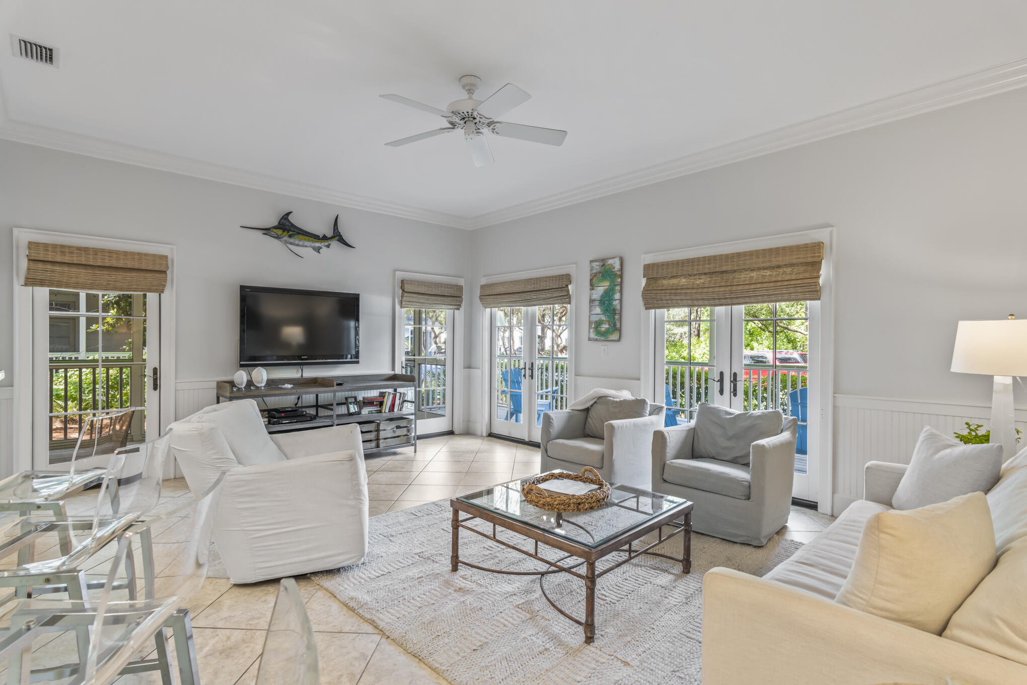 Enjoy the perfect moments in your condo beach getaway in the heart of Watercolor! Across the street from Cerulean Park and a two-minute stroll from the beach, this beautiful and bright two-bedroom, two-bathroom property is located in Watercolor's most desirable neighborhood. All of the rooms are on one level and are on the ground floor, making them accessible to family and friends of all ages and providing beautiful park views. A few of the numerous features include an open floor plan, spacious rooms, 10' ceilings, crown molding, double French doors that open to the covered porch overlooking the park, and a screened-in private side porch. The master bath has double sinks, large tub, and oversized walk in shower. From the second bedroom or hallway...