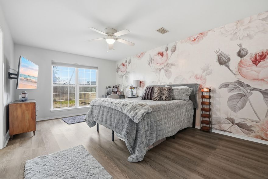 Hunter's Run offers the perfect blend of location and livability. This freshly painted, all-brick 4BR/3BA home features a vaulted living area with corner fireplace, formal dining room with beautifully selected chandeliers, and an updated eat-in kitchen with island. The main level includes a spacious primary suite with walk-in closet and large bath, plus a guest bedroom and full bath. Upstairs offers a versatile loft, two additional bedrooms, and a beautifully updated bath with new subway tile. Enjoy a screened Florida room, fenced backyard, whole-home generator, underground utilities, and street lights--convenient to bases, shopping, the industrial park, mall, and schools.