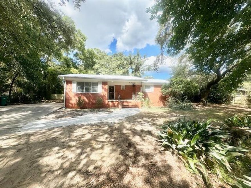 ***Available January 7th!!!*****18-month lease considered. Lock in your rate longer and reduce move hassle!**Welcome to this beautifully updated brick home, offering a perfect blend of classic charm and modern comfort. With 4 spacious bedrooms and 3 full baths, this home provides plenty of space for families or anyone looking for a serene retreat.As you enter, you're greeted by an open-concept living area featuring hardwood floors and exposed wood beams that add a rustic touch to the contemporary design. The bright and airy kitchen boasts sleek countertops, a large island, and modern appliances, perfect for entertaining or enjoying family meals. The adjacent dining and living areas flow seamlessly, providing a cozy space to relax or entertain guests. The bathrooms have a spacious walk-in shower, modern fixtures, and stylish finishes. The primary bedroom and additional bedrooms are filled with natural light, each offering generous closet space and ceiling fans for added comfort.

Step outside to a large backyard patio, ideal for outdoor dining or simply unwinding under the shade of mature trees. With ample room for activities and privacy, it's the perfect space to enjoy the outdoors.

Obligo: ***Cut the Upfront Costs  Move In Without a Security Deposit!***
We've partnered with Obligo to help qualified renters save money when it matters most.

*All pets are registered via pet screening, and all assistance animals are verified through the same screening process.**

**Carpet cleaning (if applicable) & Admin Fee charged **

Tenant to verify all data. Please contact Sound Choice Real Estate to schedule a showing- 850-389-8533.

***Approval is based on several factors as follows***
- Rental History and Verification
- Employment History and Verification
- Credit History
- Criminal Background & Terrorist Database Check
- Pet Verification