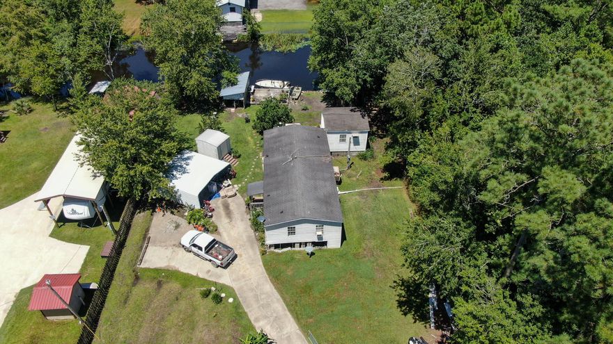 Double wide mobile home with several out buildings sitting on a gorgeous lot on a quiet dead end road situated on deep water Alaqua Creek with access to Choctawhatchee Bay and more. Catch fish from your own private dock or jump in your boat and head out into Choctawhatchee Bay which you can access the inter coastal waterway or the Gulf of Mexico.