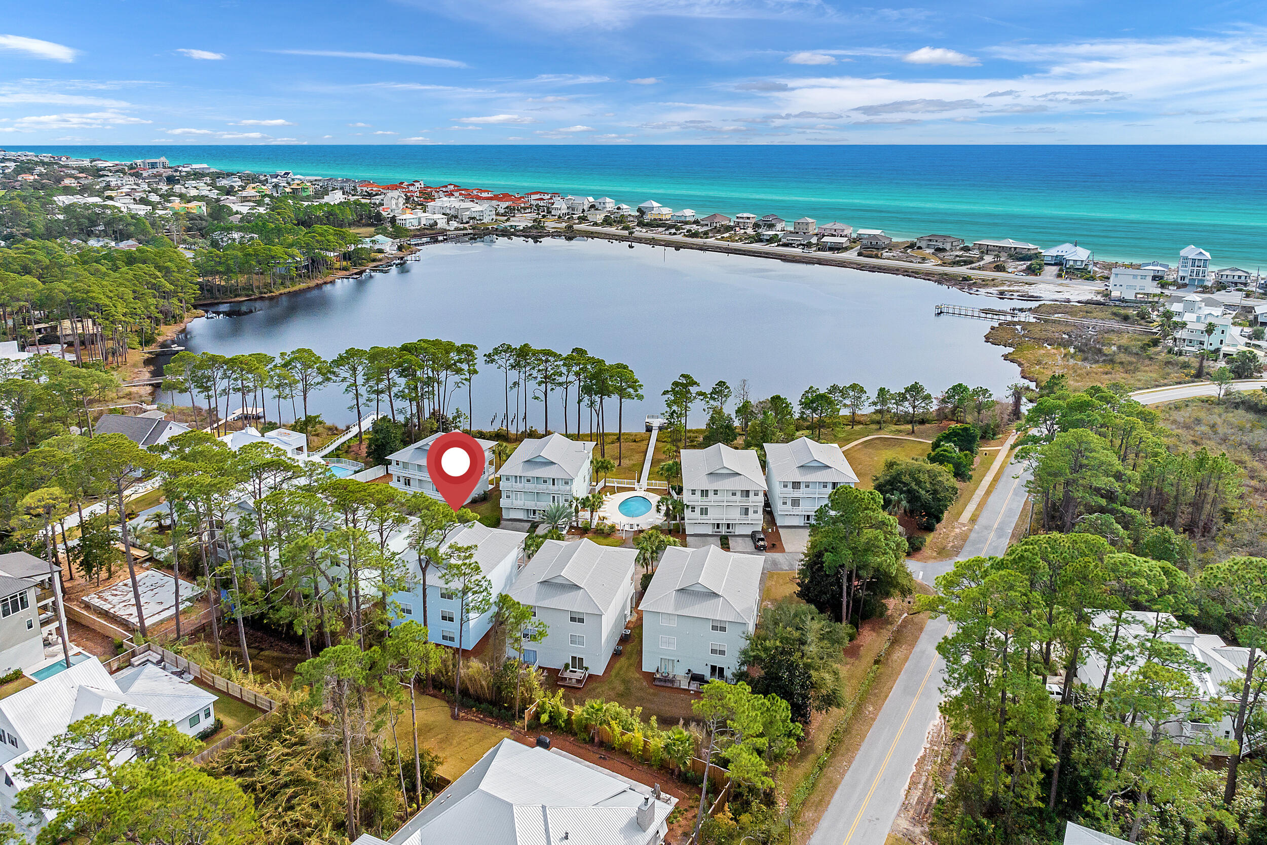 MOTIVATED SELLER! Bring ALL Offers! Beachy, lakefront dreams come to vibrant life at Peaceful Pearls, an enchanting 30A townhome with space for twelve people. Featuring lovely lake views, a community swimming pool, and easy beach access, this multi-level South Walton sanctuary offers the complete relaxation and privacy of a family home, while providing a central location and the gorgeous amenities of a five-star resort.Tucked within a charming local community that features a rainbow of pastel-colored bungalows, Peaceful Pearls has three levels for your group to spread out.