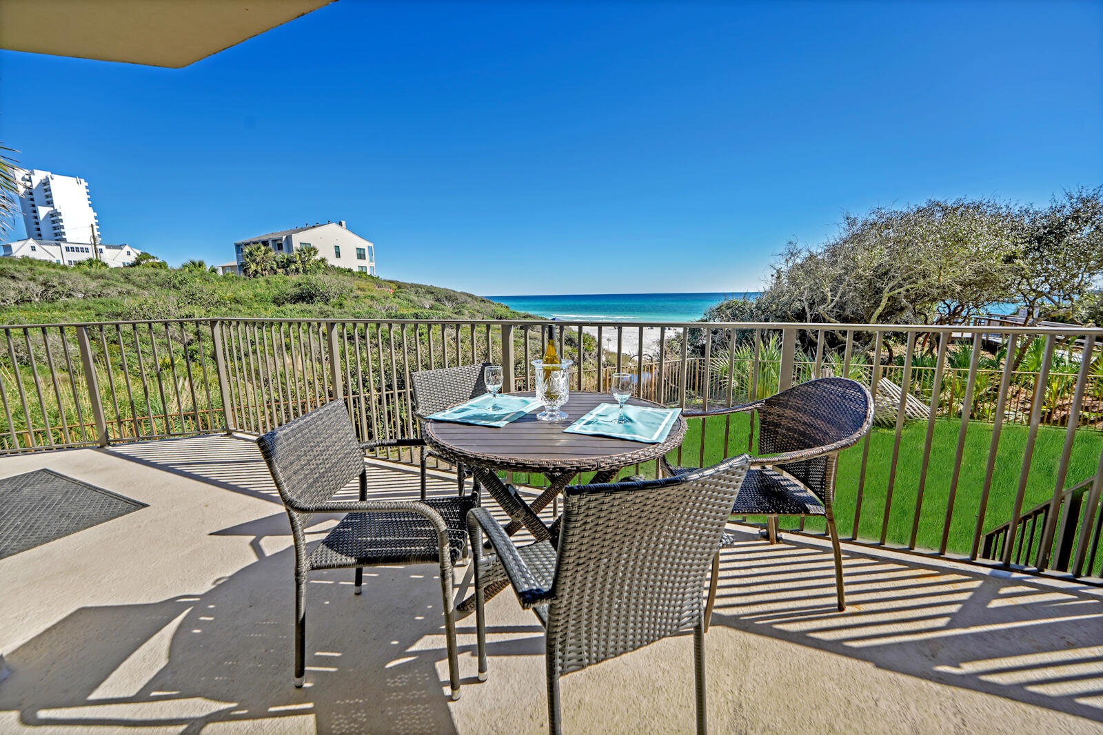 Come take a tour of this beautiful furnished condo, located in the heart of Seagrove at Legacy Condominiums. Beautifully remodeled, with the feel of seclusion and privacy are just a few short words to describe this exquisite luxury condominium. Enjoy the lush scenery of the dunes overlooking the beach. You'll feel like the sparkling emerald Gulf waters are right at your fingertips while in this unit. The view in person from this unit is truly special and is a MUST SEE in person. This unit is located in a gated complex on the ground floor, making it private with easy access directly to the beach, as you will be able to walk directly down to the beach right from your own balcony.