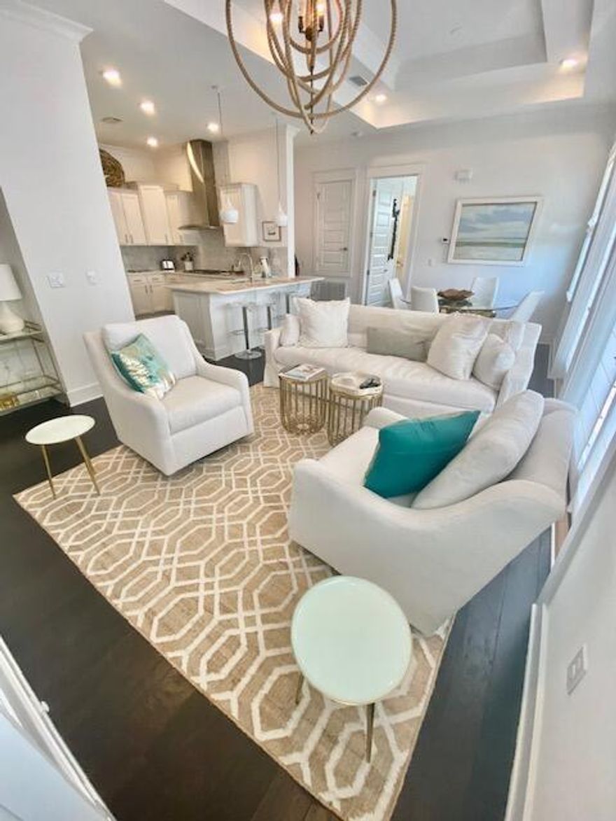 This beautifully designed and decorated condo is perfect for an investment or family vacation home. This 2 bedroom, 2 bath unit is in the Prominence Triplexes and it located close to the large community pool and a short walk to the Chill (formerly known as the HUB.)  The crisp white design is light and bright with a coastal theme. There are designer features throughout and is offered fully furnished with a few exclusions. This is a great opportunity!