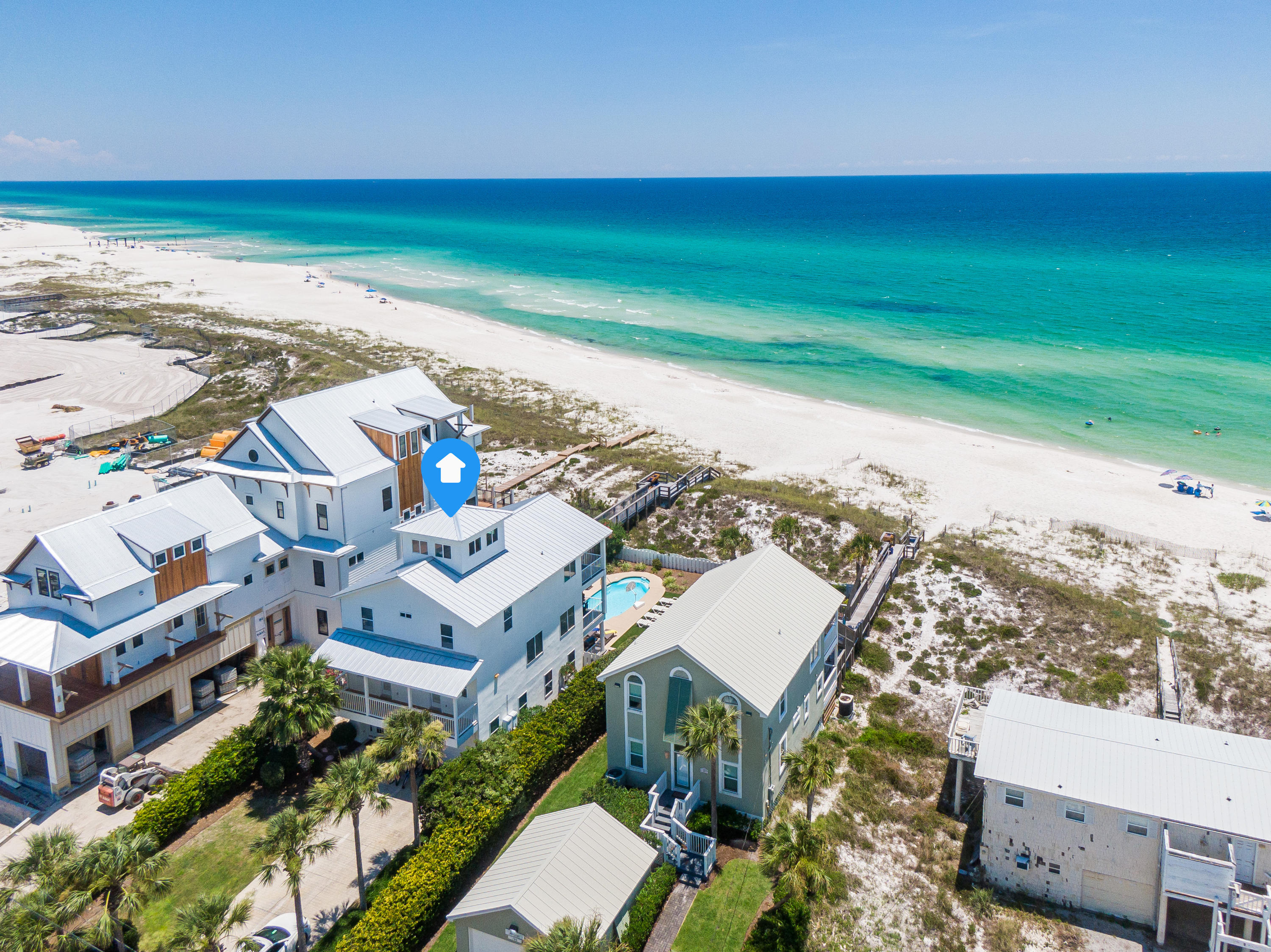 Spectacular Gulf-Front Compound. Fully-Renovated home boasting Strong Rental Income of $300,000 for 2020 and $292,000 on the books for 2021.As you enter through the front door there's a beautiful shiplap accented foyer and to your right you'll notice a wide open game room with a ping pong table, arcade games, and two adjoining bedrooms, one of which is a bunk-room, making this the perfect hangout space for the kids. Moving along to the 2nd level offers breathtaking views of the gulf that begin to shine bright as you ascend to the top of the staircase. This 2nd level holds light-filled living spaces with beautiful coastal decor, a wide open kitchen with stainless steel appliances, a dining room with stunning gulf vistas, and a large guest bedroom with ensuite bath.