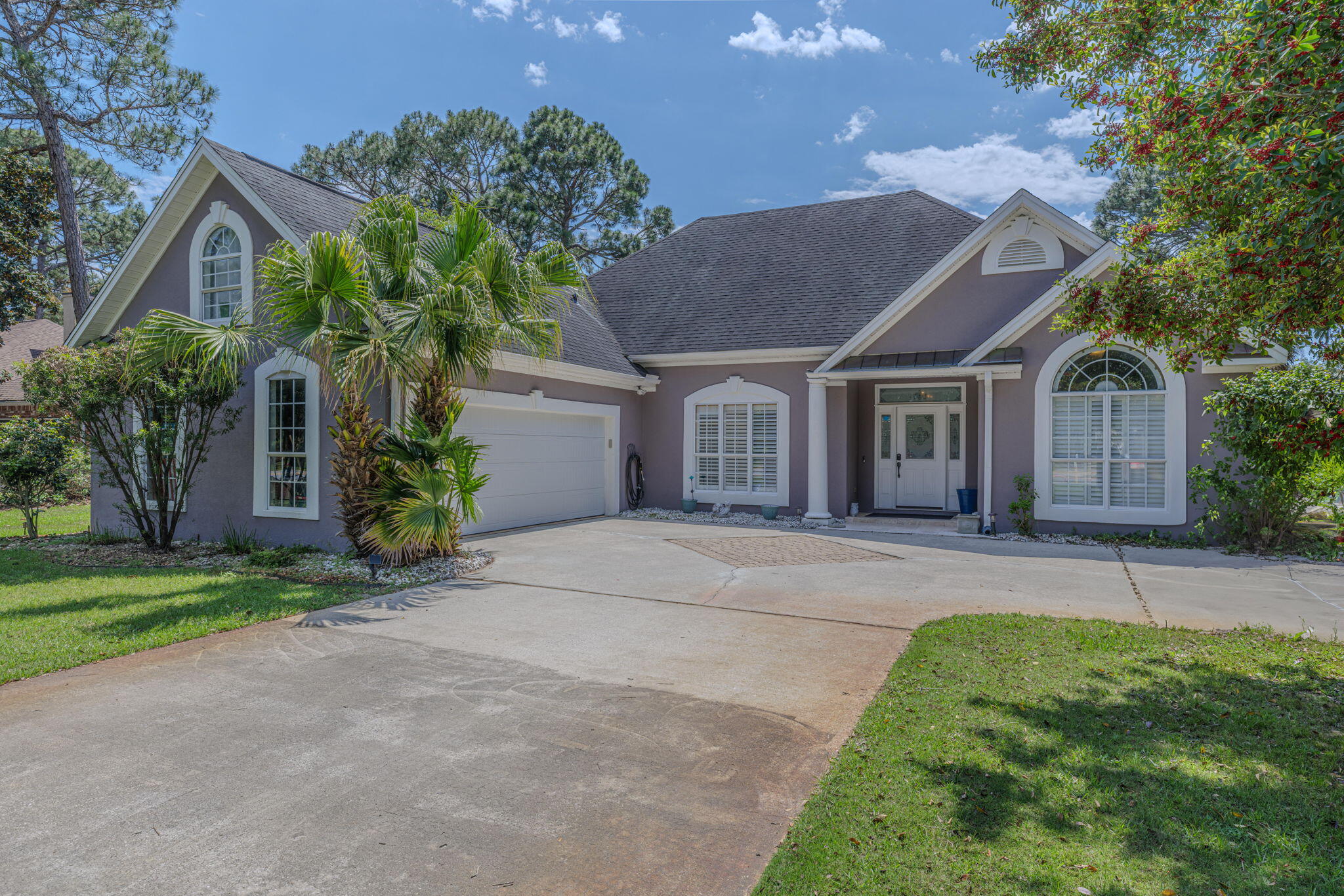 Welcome to costal living in the heart of Destin right on highly sought after Indian Trail! As you pull into this home you will immediately feel as if you've arrived to paradise. When you enter the home you're invited with natural lighting, coffered ceilings, shiplapped walls, tile flooring, updated primary bathroom, and recently renovated kitchen with gas stove and updated appliances. The spacious floor plan with exquisite updated details makes this home feel like new. Enjoy the outdoor lifestyle with your own private screened-in pool. Perfect for entertaining guests or enjoying some quiet time floating in the privacy of your own backyard. Located in the heart of West Destin, you are conveniently located to many of Destin's top rated restaurants, grocery stores, shopping, & beach living!