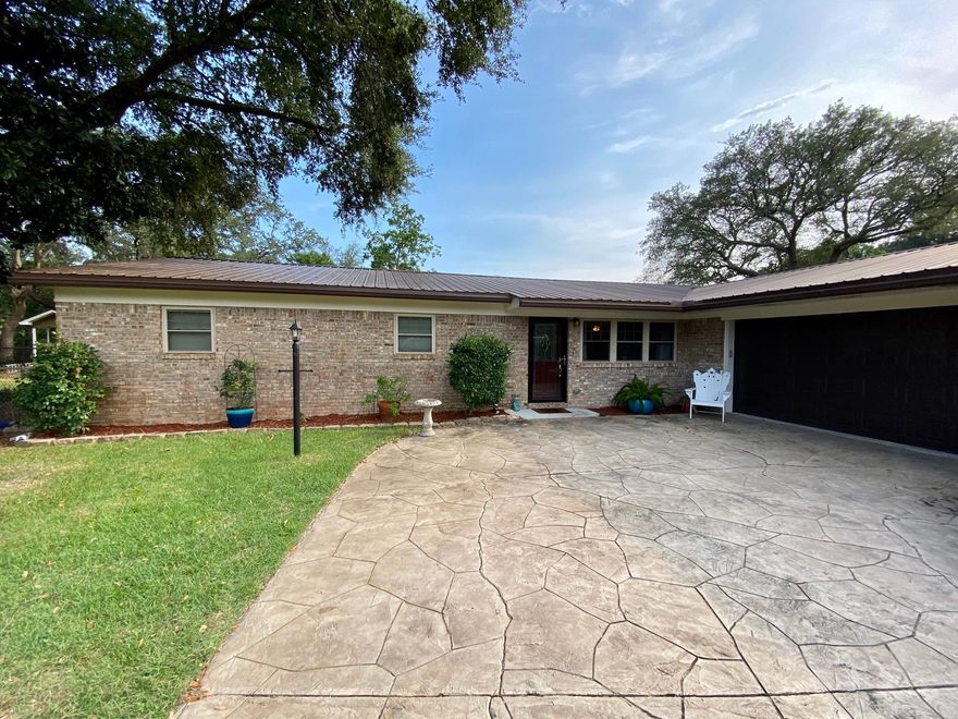 Location Location Location!! Three-bedroom two bath all brick home located in the heart of Niceville. You will absolutely love this very open floor plan with fireplace and custom cedar mantle. A complete remodel has been done. All new light fixtures, A/C system (2015) metal roof (2015). All new 4in. baseboards, new trim and custom triple stack crown molding.  The kitchen boasts new cabinets with granite counter tops and stainless-steel appliances. Both bathrooms have custom tile floors and granite counter top vanities. The master suite is grand with its custom built in reading nook with ample storage, vinyl plank flooring and new light fixtures. The family room, dining room and kitchen are all open to one another making the home perfect for entertaining. The wood flooring throughout the main areas gives the home a rich but comfortable feeling. The laundry room is large enough to add a freezer if needed.  If you have kids or pets, you will love the back yard with a large custom built fire pit and covered patio. Large two car garage with recently repainted ceiling and walls, painted with kilz anti mold paint for added protection.  Call today for a viewing.  This home will not last long.